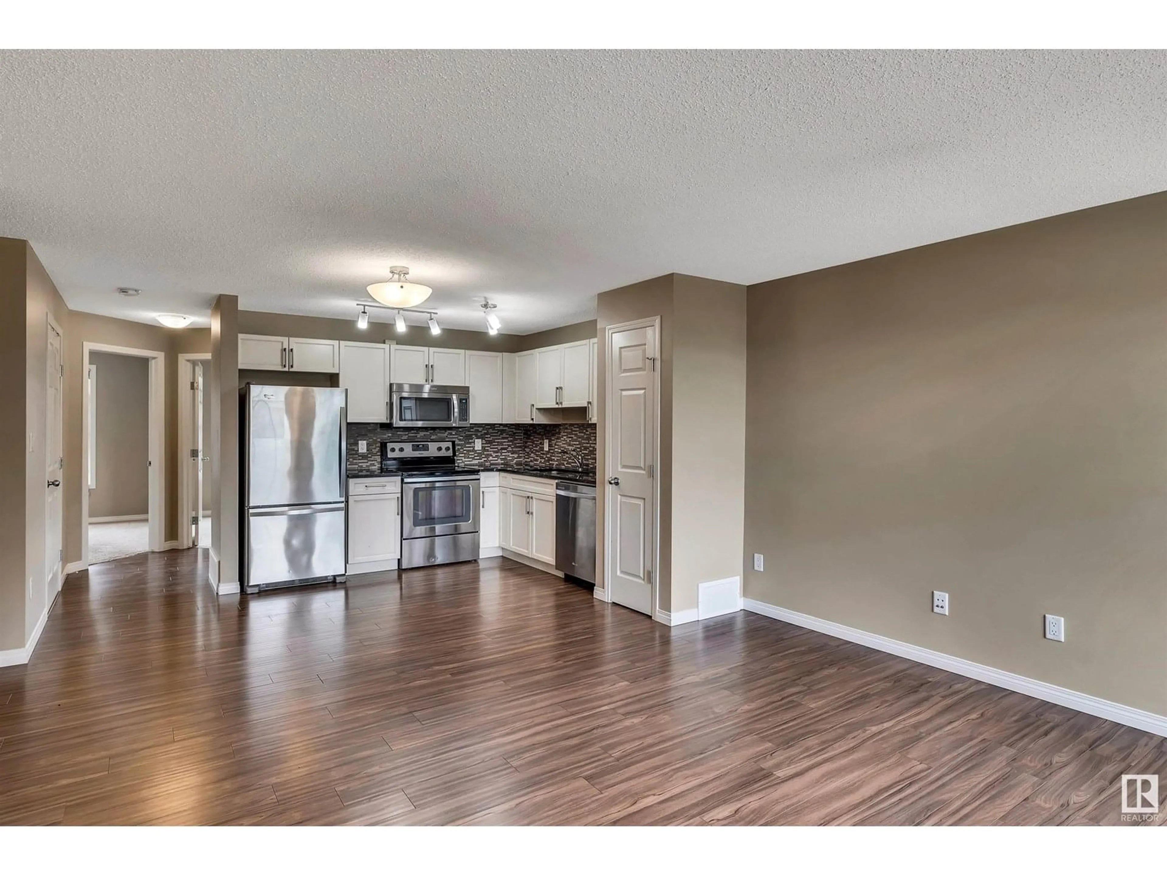 Open concept kitchen, wood/laminate floor for 4029 - 60 ORCHARDS DR, Edmonton Alberta T6X1V2