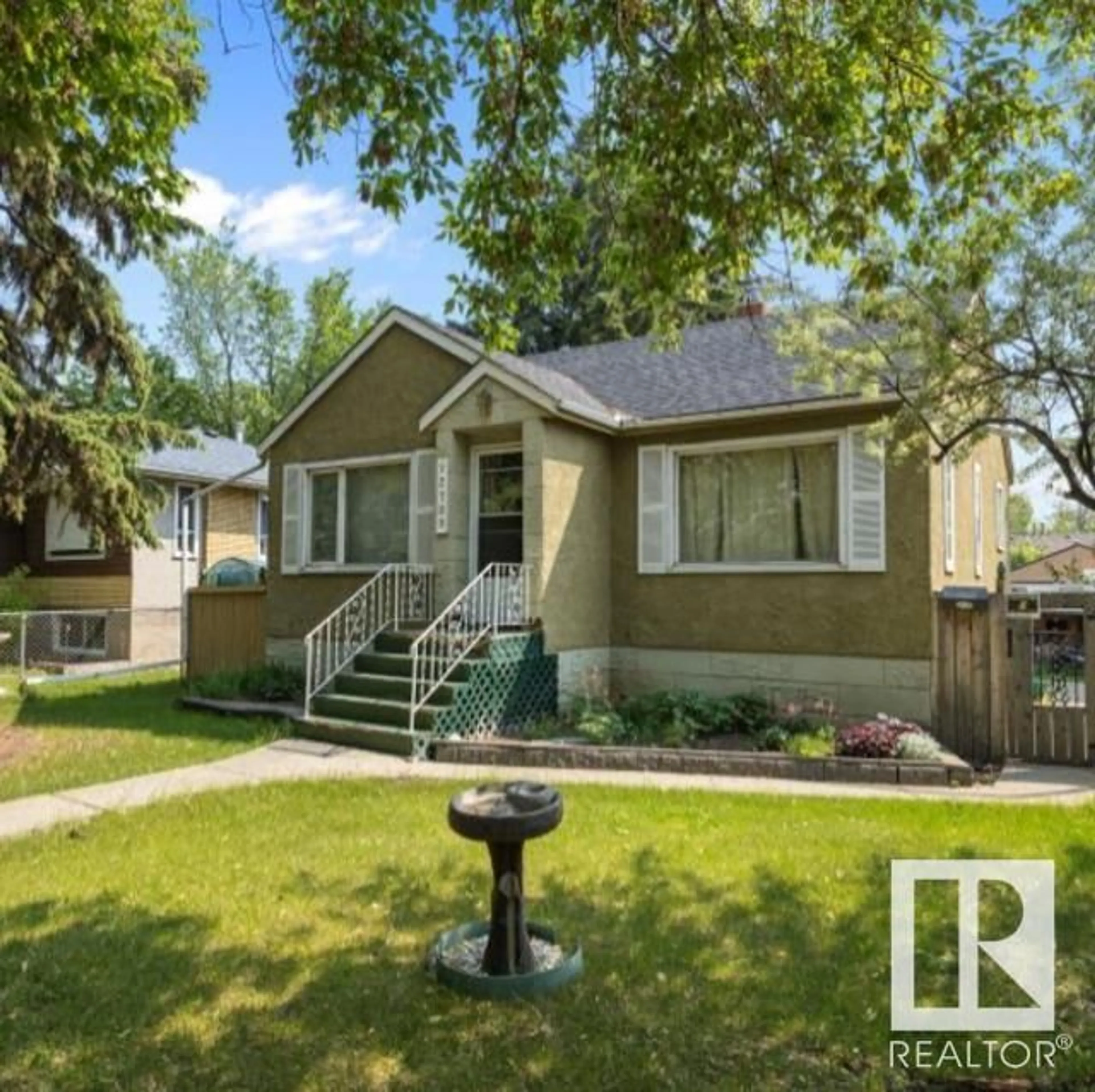 Home with vinyl exterior material, street for 12709 126 ST, Edmonton Alberta T5L0X9