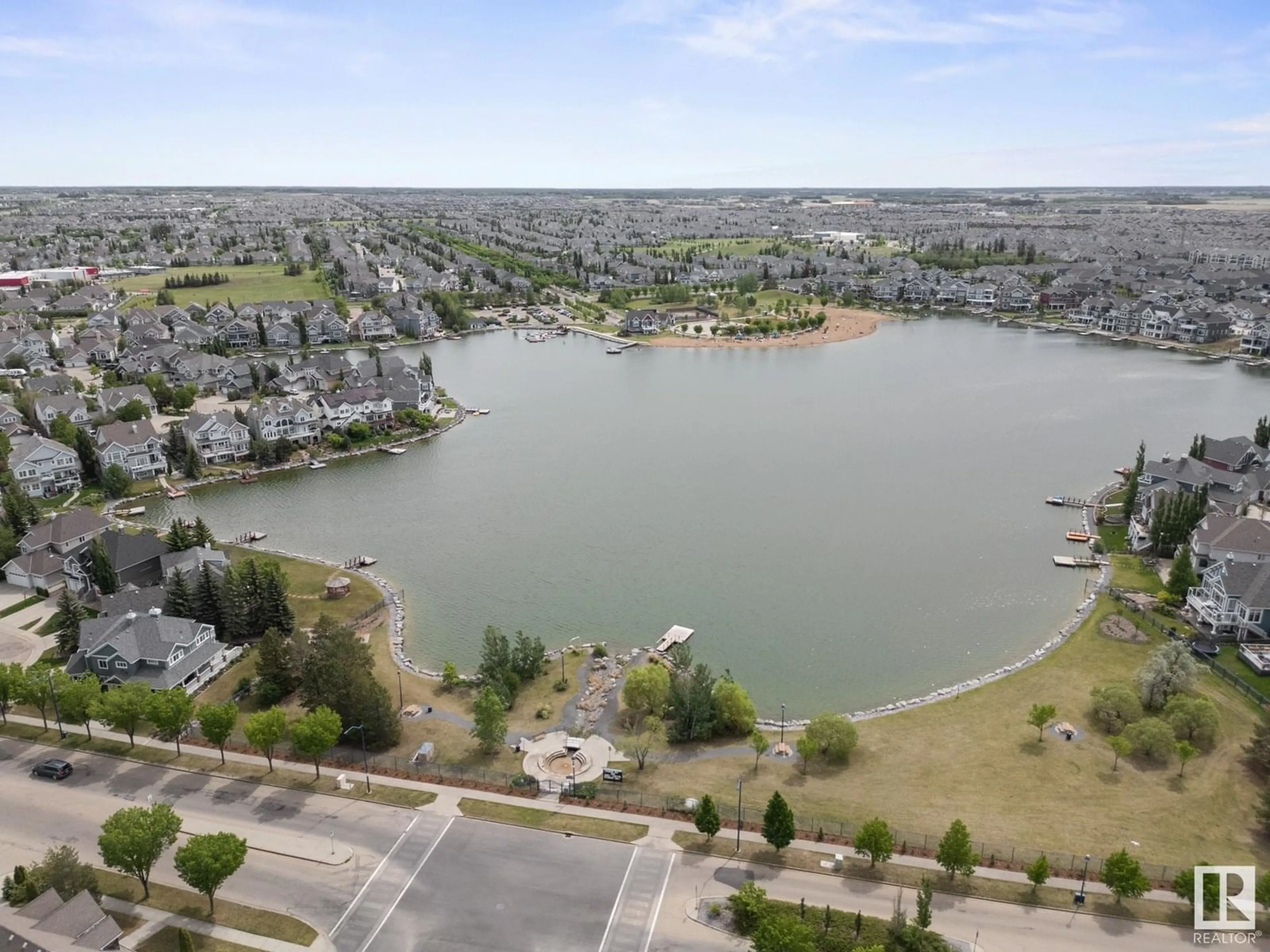 A pic from outside/outdoor area/front of a property/back of a property/a pic from drone, water/lake/river/ocean view for LI SW - 912 SUMMERSIDE LINK, Edmonton Alberta T6X1B2