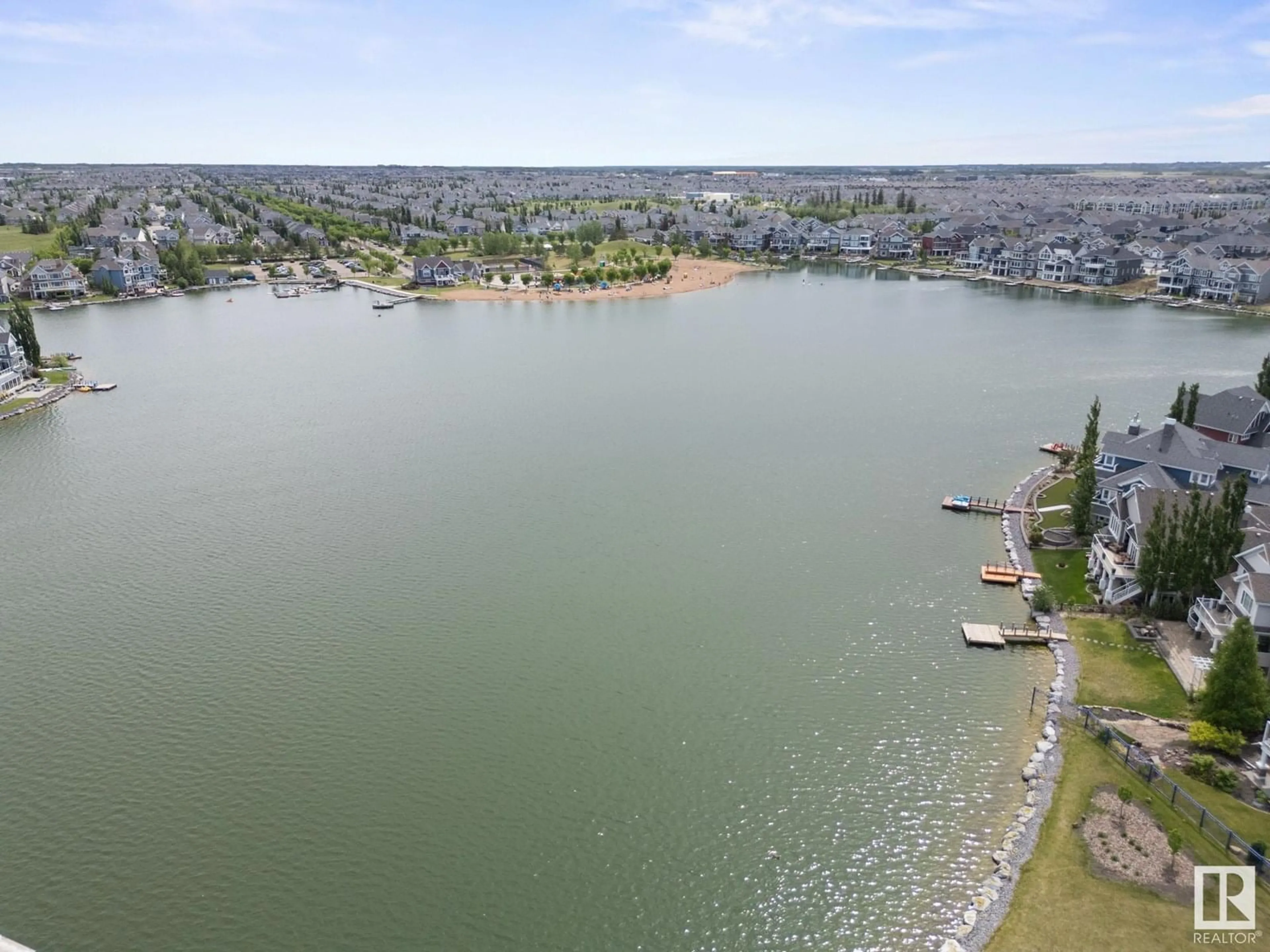 A pic from outside/outdoor area/front of a property/back of a property/a pic from drone, water/lake/river/ocean view for LI SW - 912 SUMMERSIDE LINK, Edmonton Alberta T6X1B2