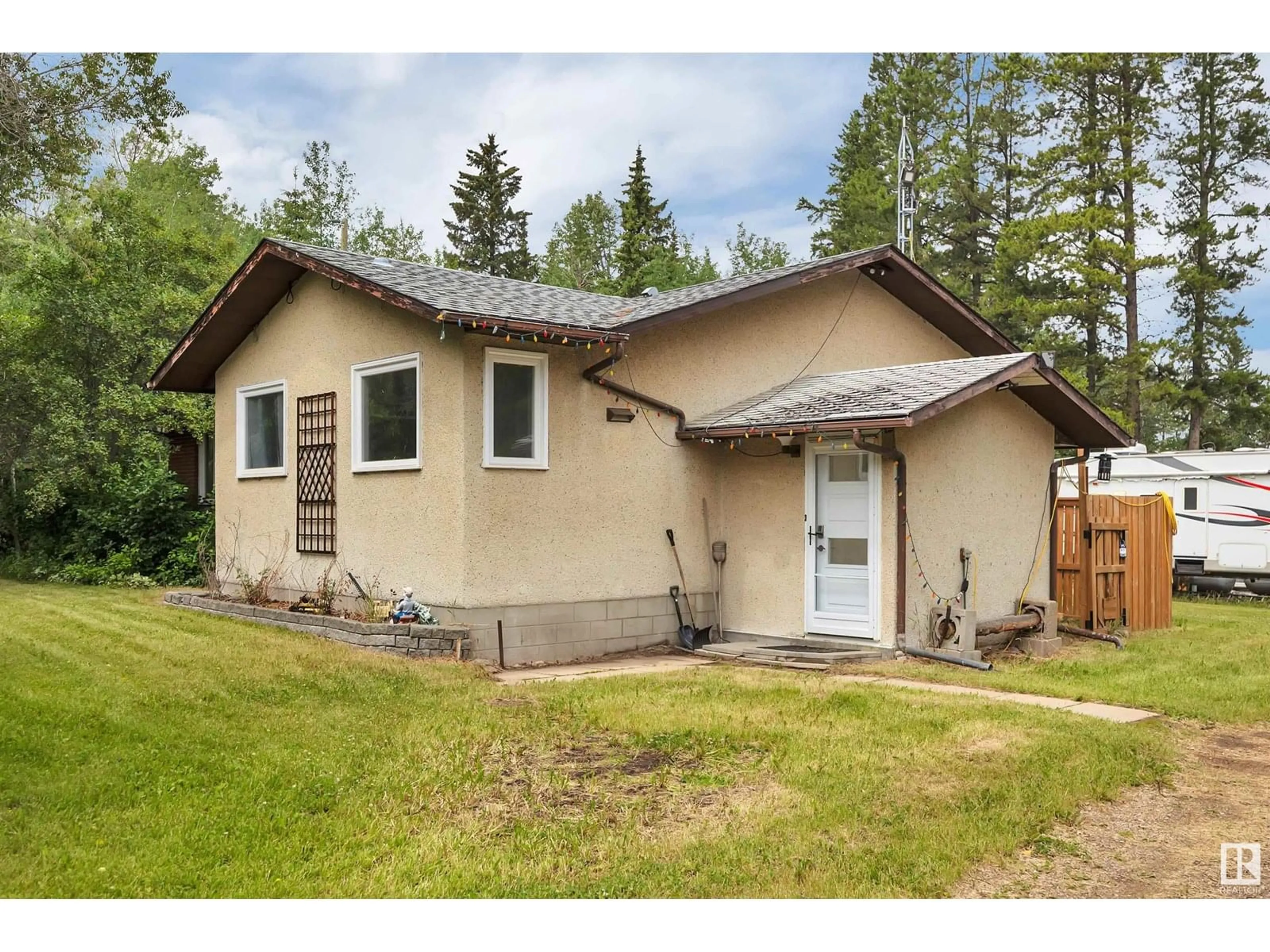 Home with vinyl exterior material, street for 253046 TWP ROAD 472, Rural Wetaskiwin County Alberta T0C1Z0