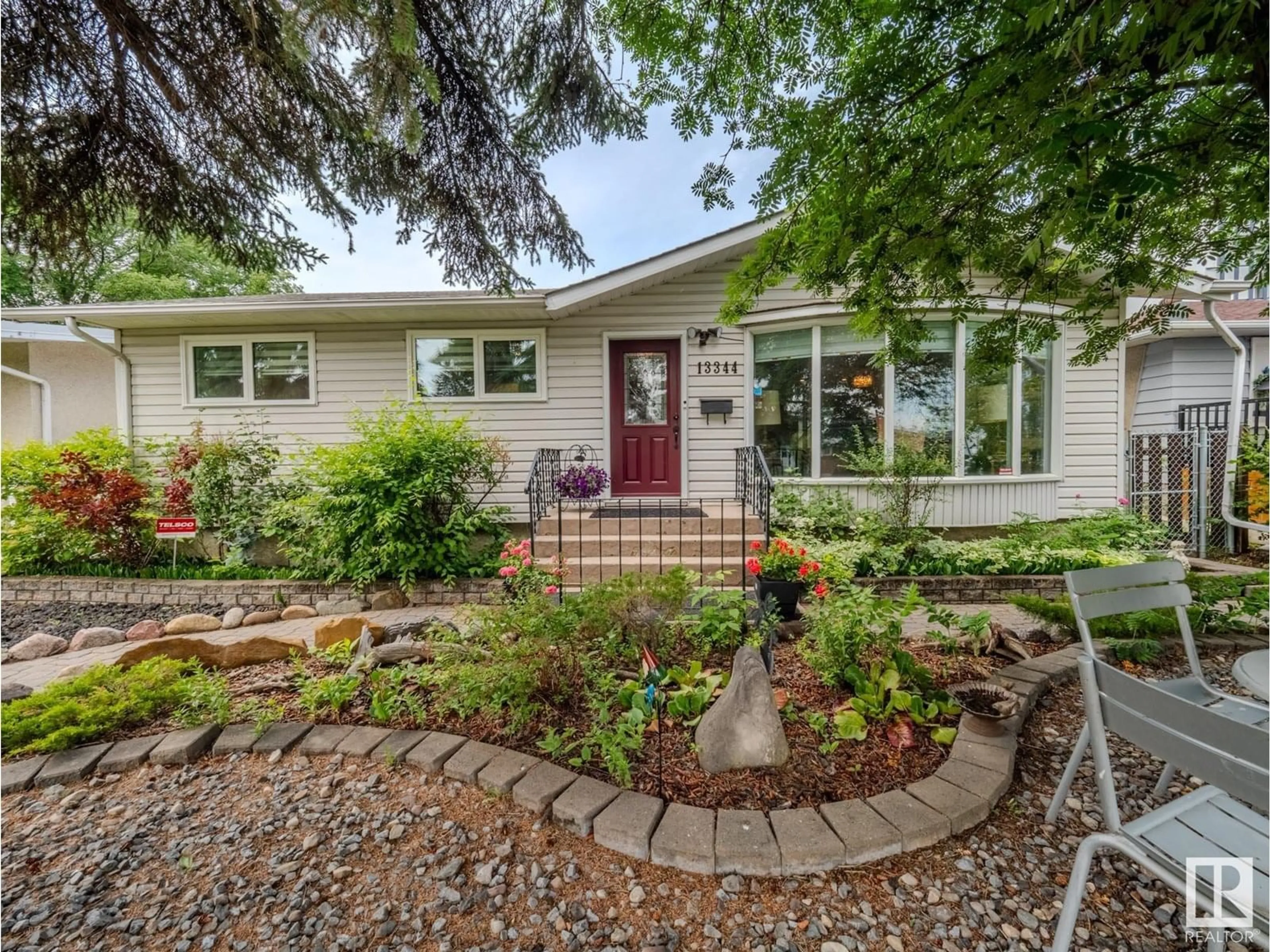 Home with vinyl exterior material, street for NW - 13344 96 ST, Edmonton Alberta T5E4B3