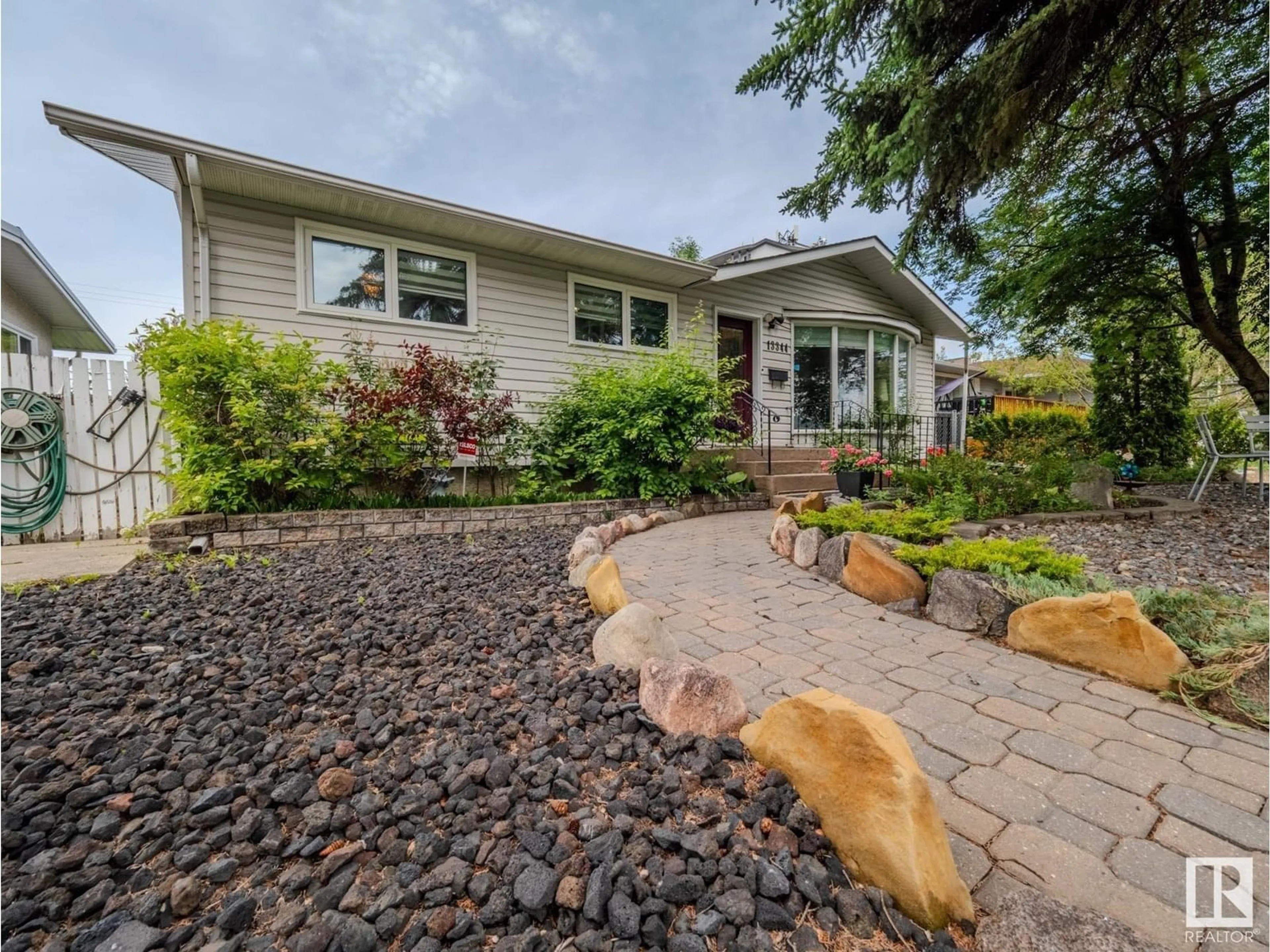 Home with vinyl exterior material, street for NW - 13344 96 ST, Edmonton Alberta T5E4B3