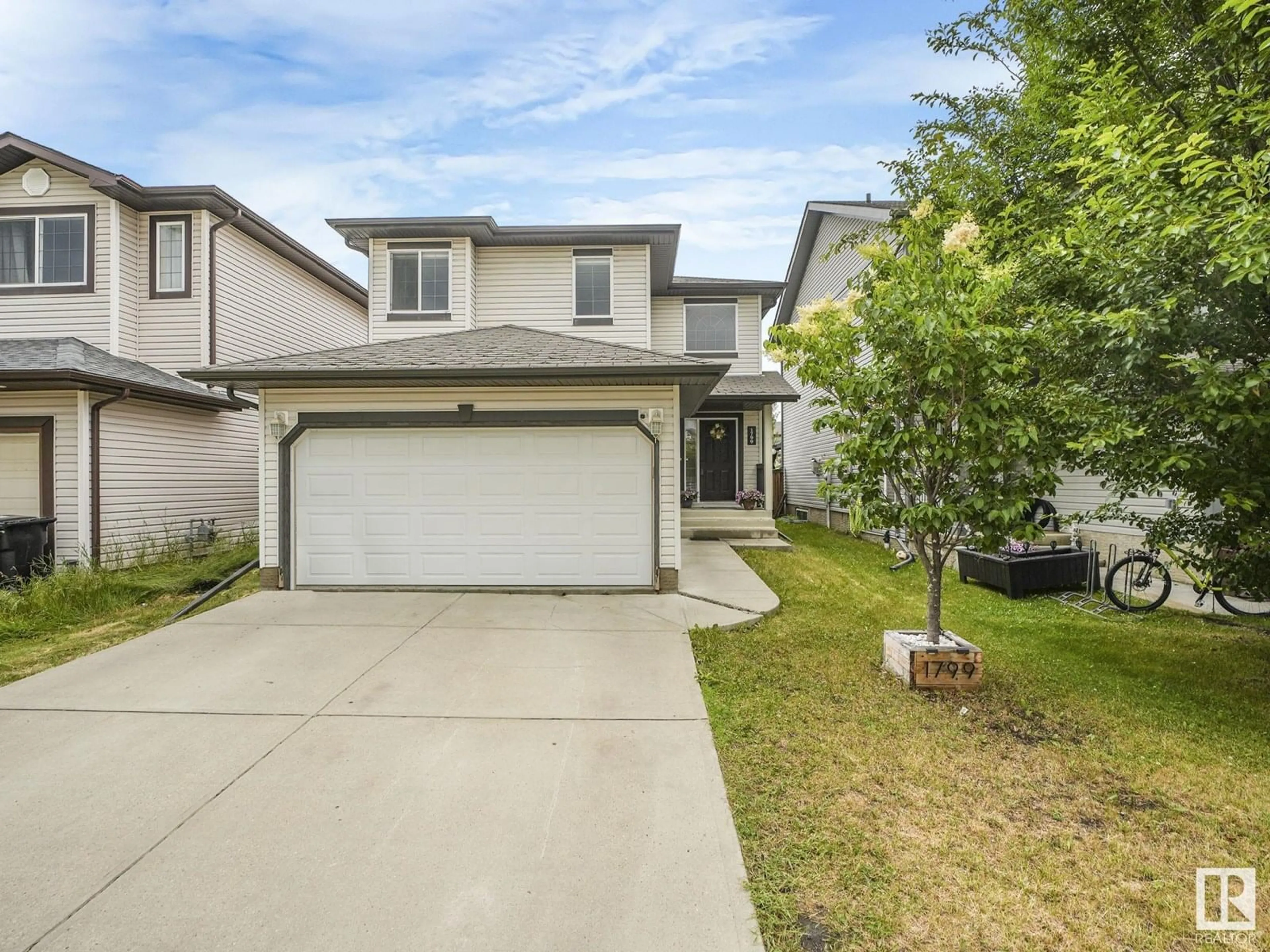 A pic from outside/outdoor area/front of a property/back of a property/a pic from drone, street for 1799 HAMMOND CR, Edmonton Alberta T6M0H9