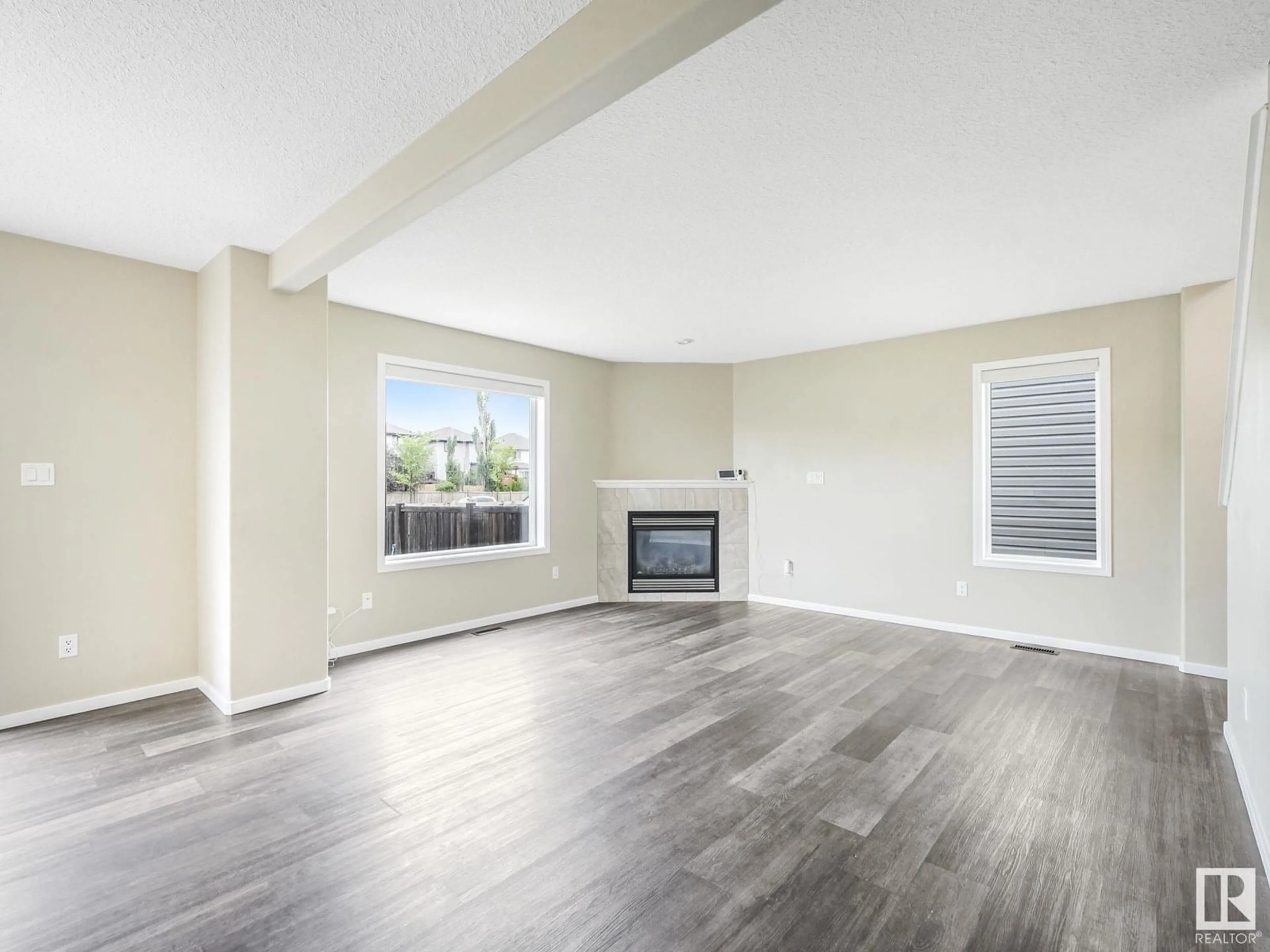 Living room with furniture, wood/laminate floor for 1799 HAMMOND CR, Edmonton Alberta T6M0H9