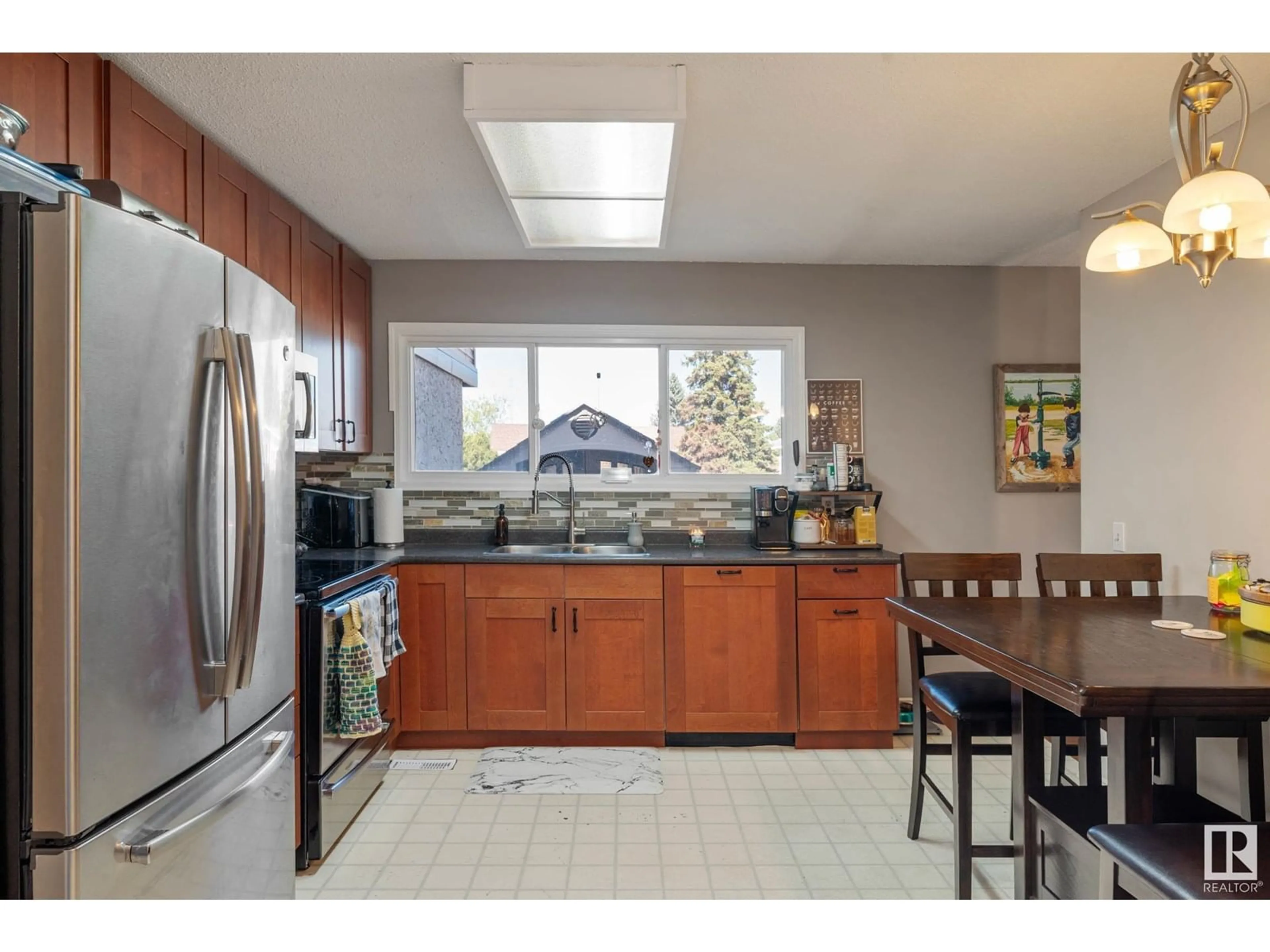 Open concept kitchen, ceramic/tile floor for 457 KNOTTWOOD RD, Edmonton Alberta T6K2V6