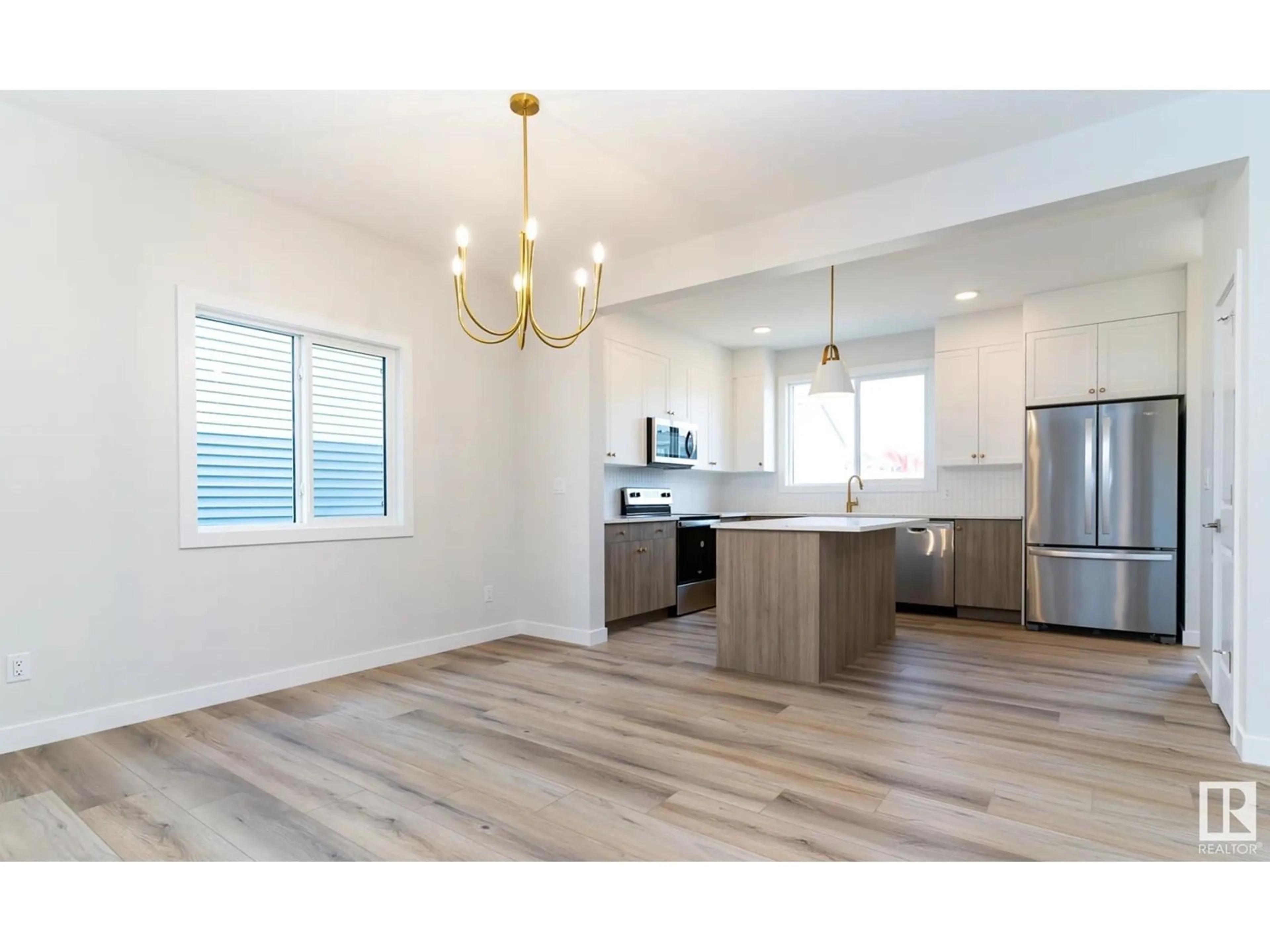 Open concept kitchen, wood/laminate floor for 6134 CARR RD, Edmonton Alberta T5E6Y3