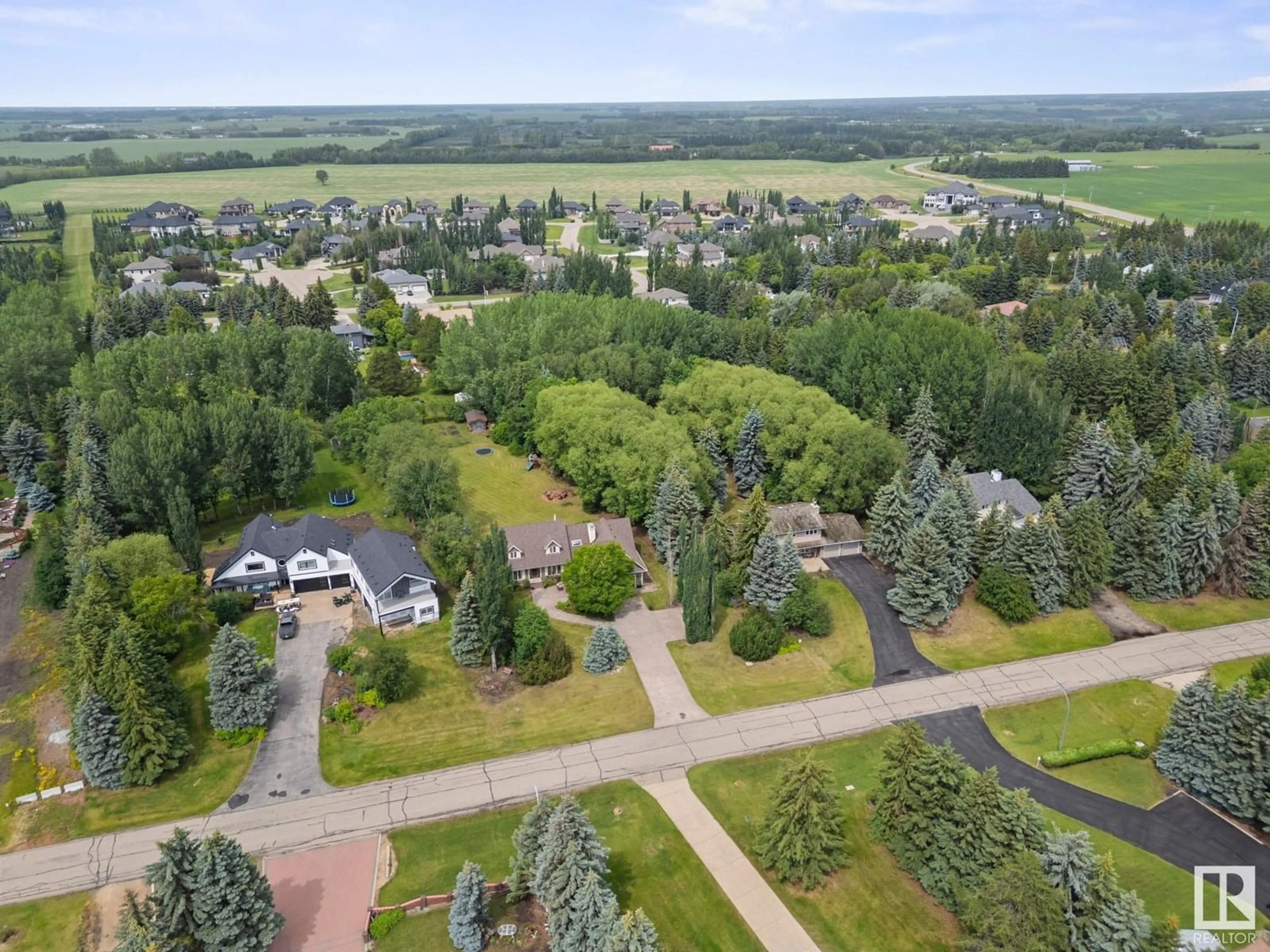 A pic from outside/outdoor area/front of a property/back of a property/a pic from drone, forest/trees view for 24 54418 RGE ROAD 251, Rural Sturgeon County Alberta T8T0C7