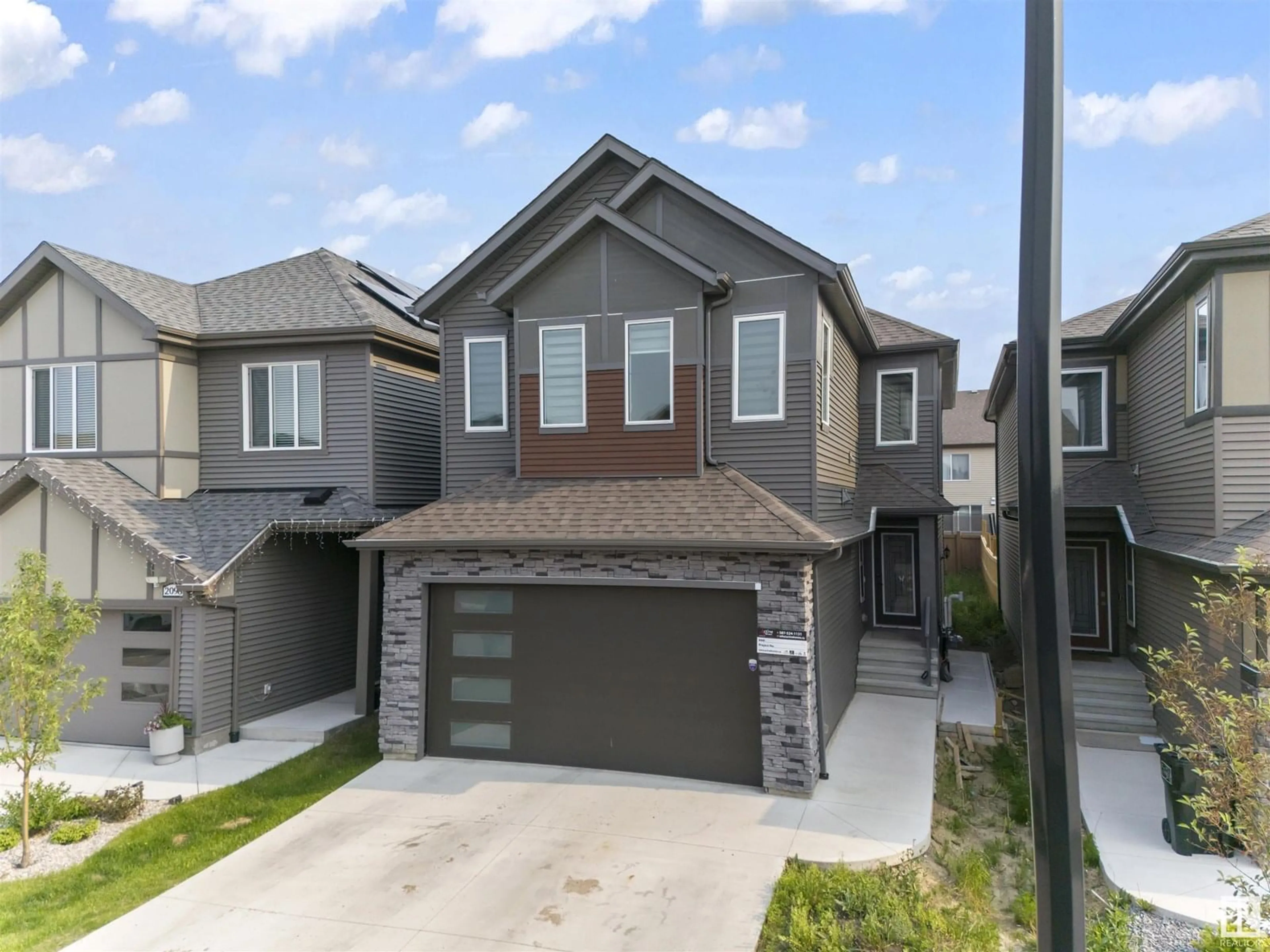 Home with vinyl exterior material, street for 2096 GRAYDON HILL CR, Edmonton Alberta T6W4K6