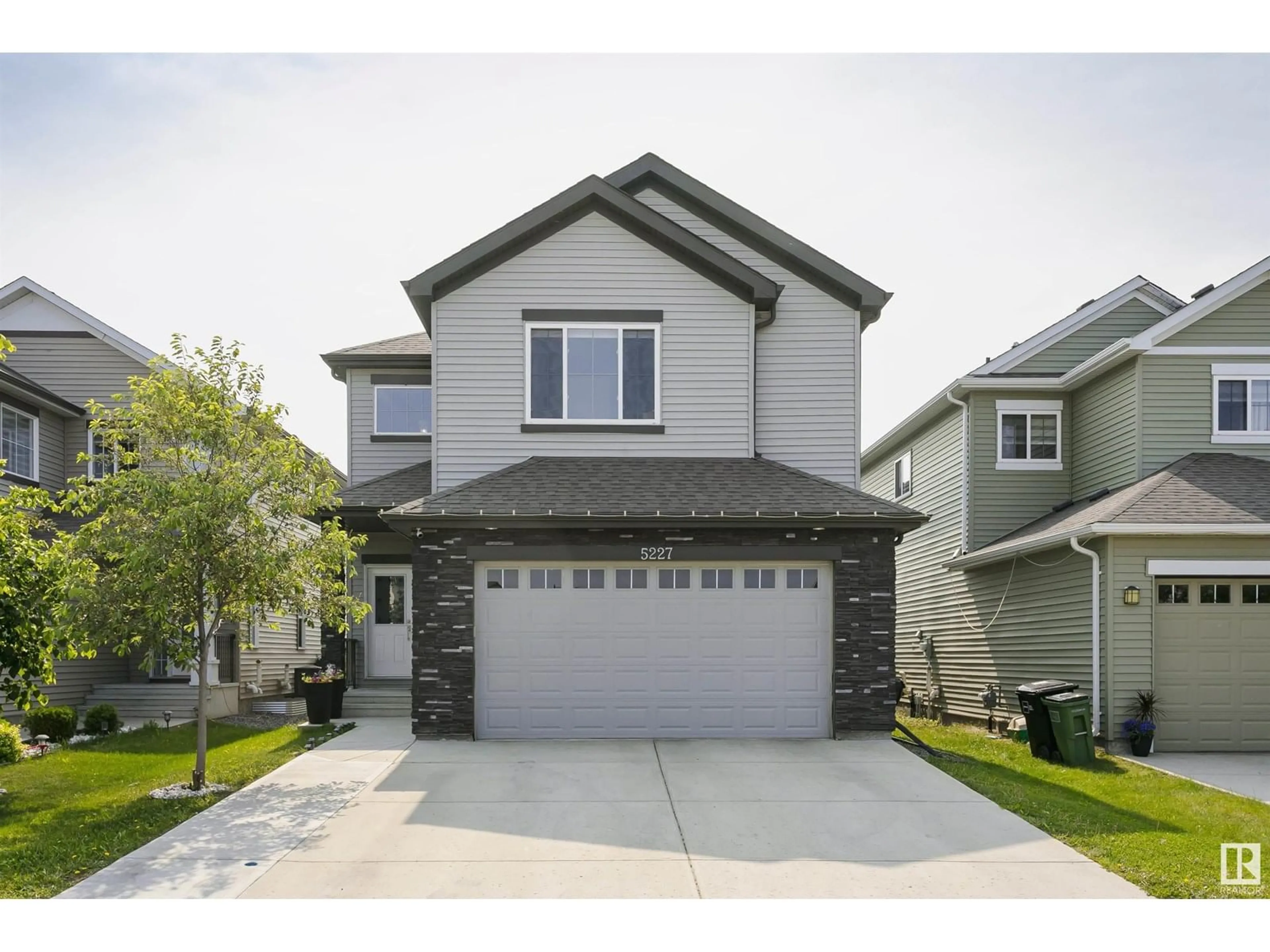 Home with vinyl exterior material, street for 5227 18 AV, Edmonton Alberta T6X1Y1