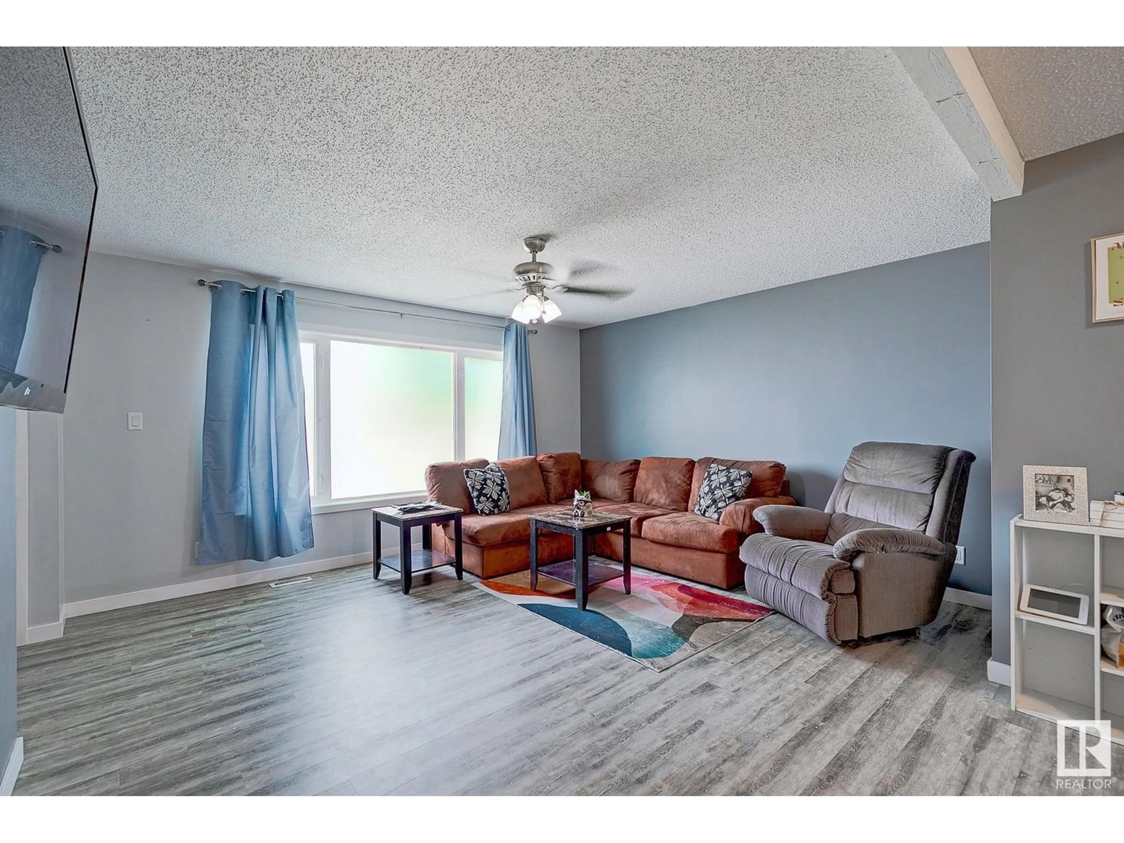 Living room with furniture, wood/laminate floor for 14547 21 ST, Edmonton Alberta T5Y1T7