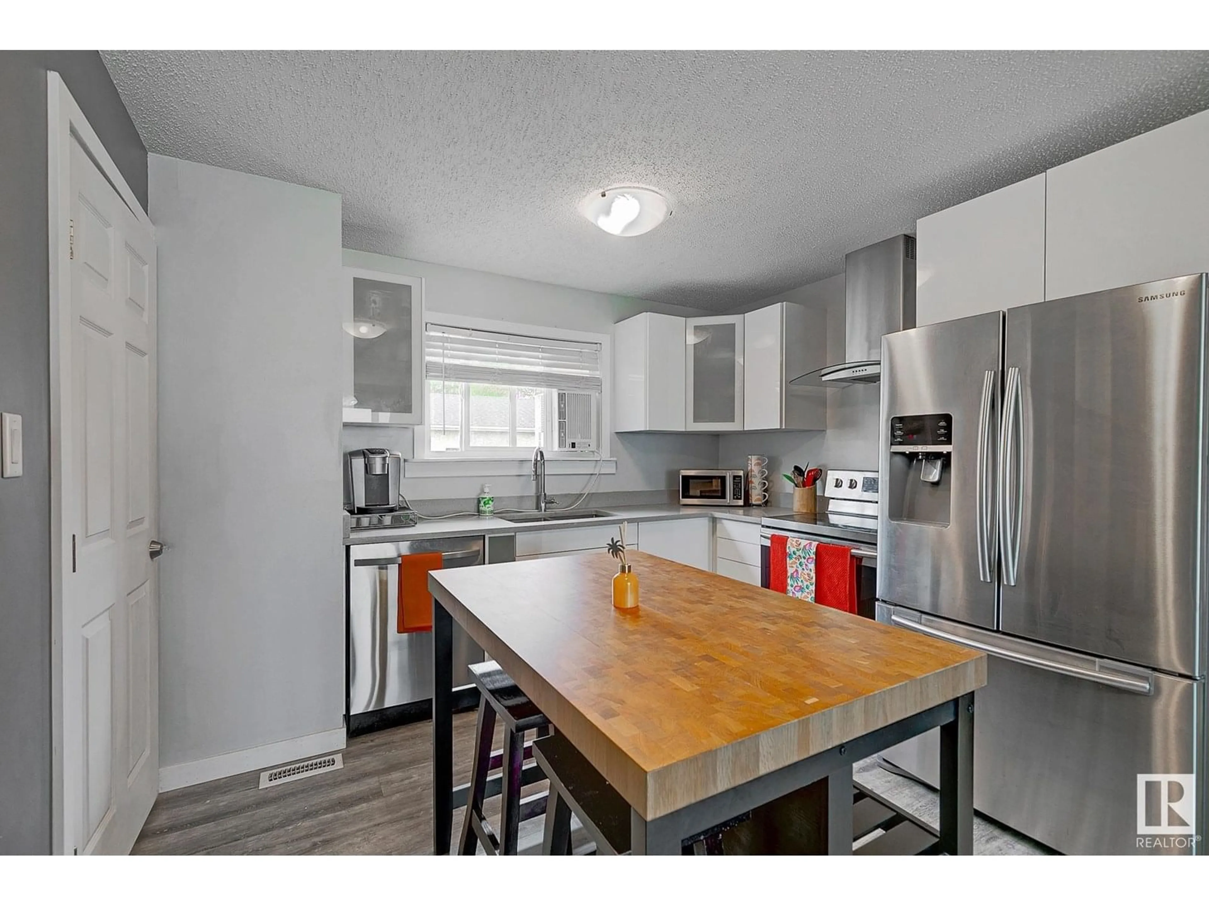Open concept kitchen, wood/laminate floor for 14547 21 ST, Edmonton Alberta T5Y1T7