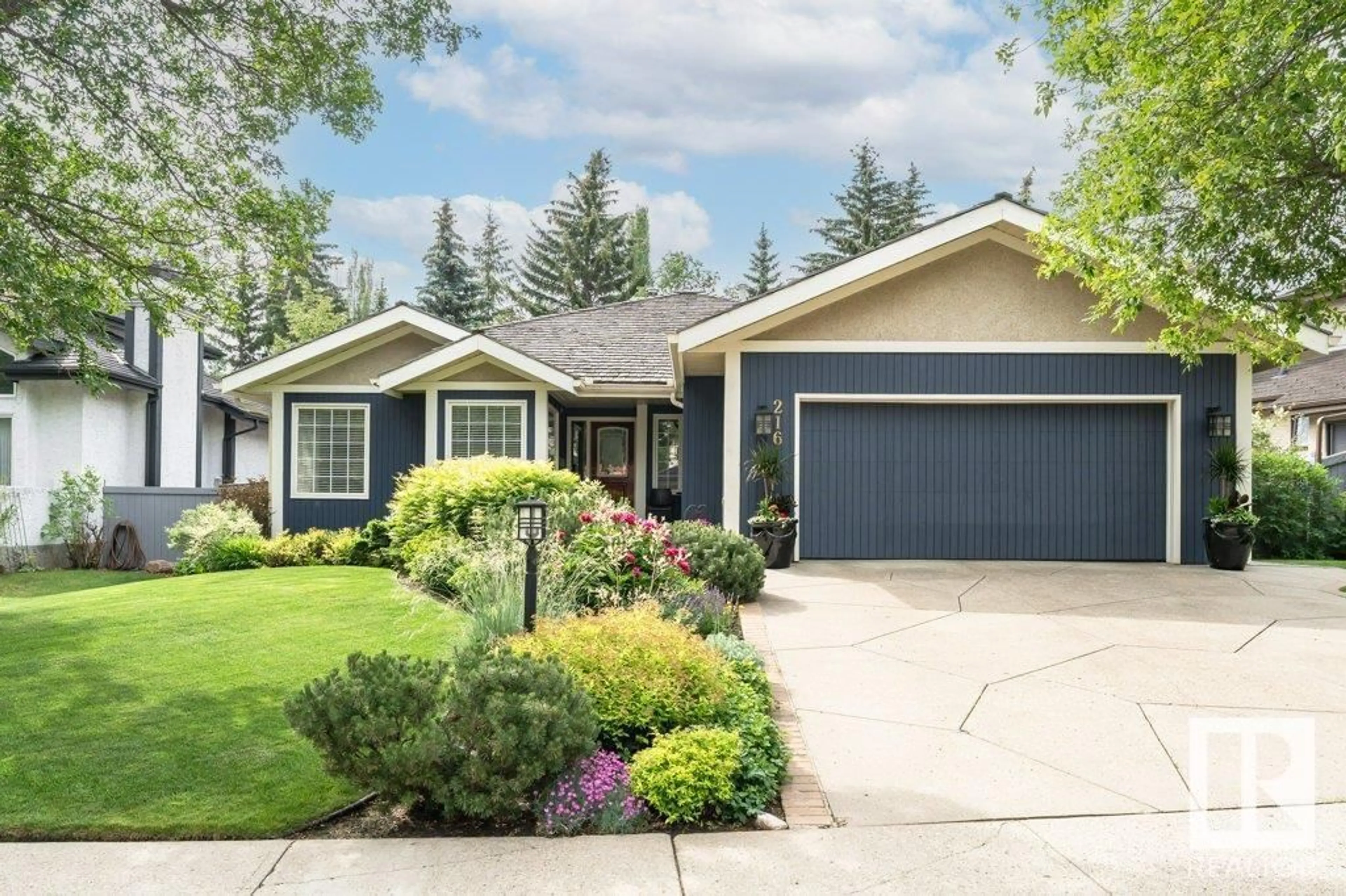 Home with vinyl exterior material, street for 216 OMAND DR, Edmonton Alberta T6R1L7