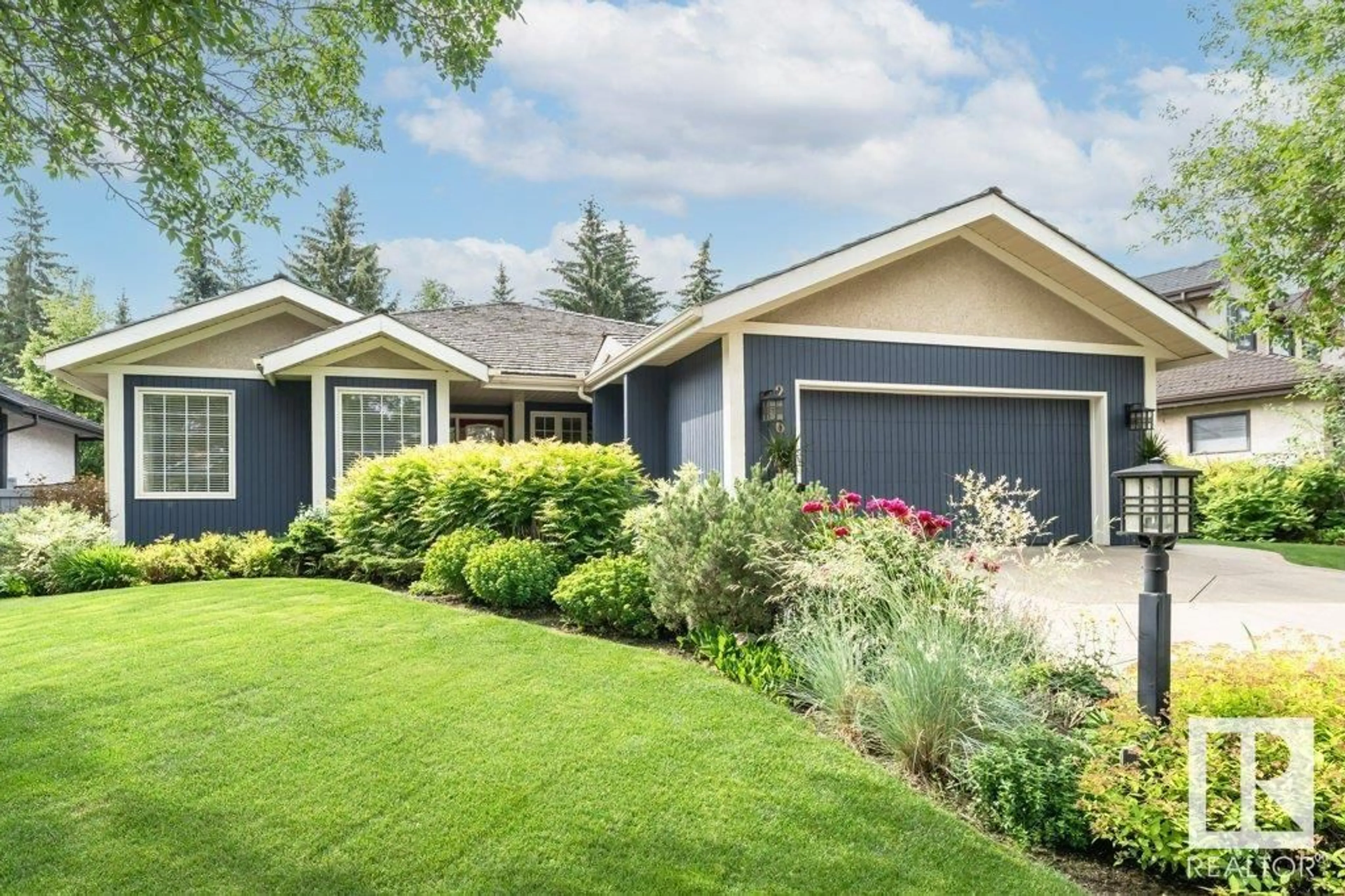 Home with vinyl exterior material, street for 216 OMAND DR, Edmonton Alberta T6R1L7