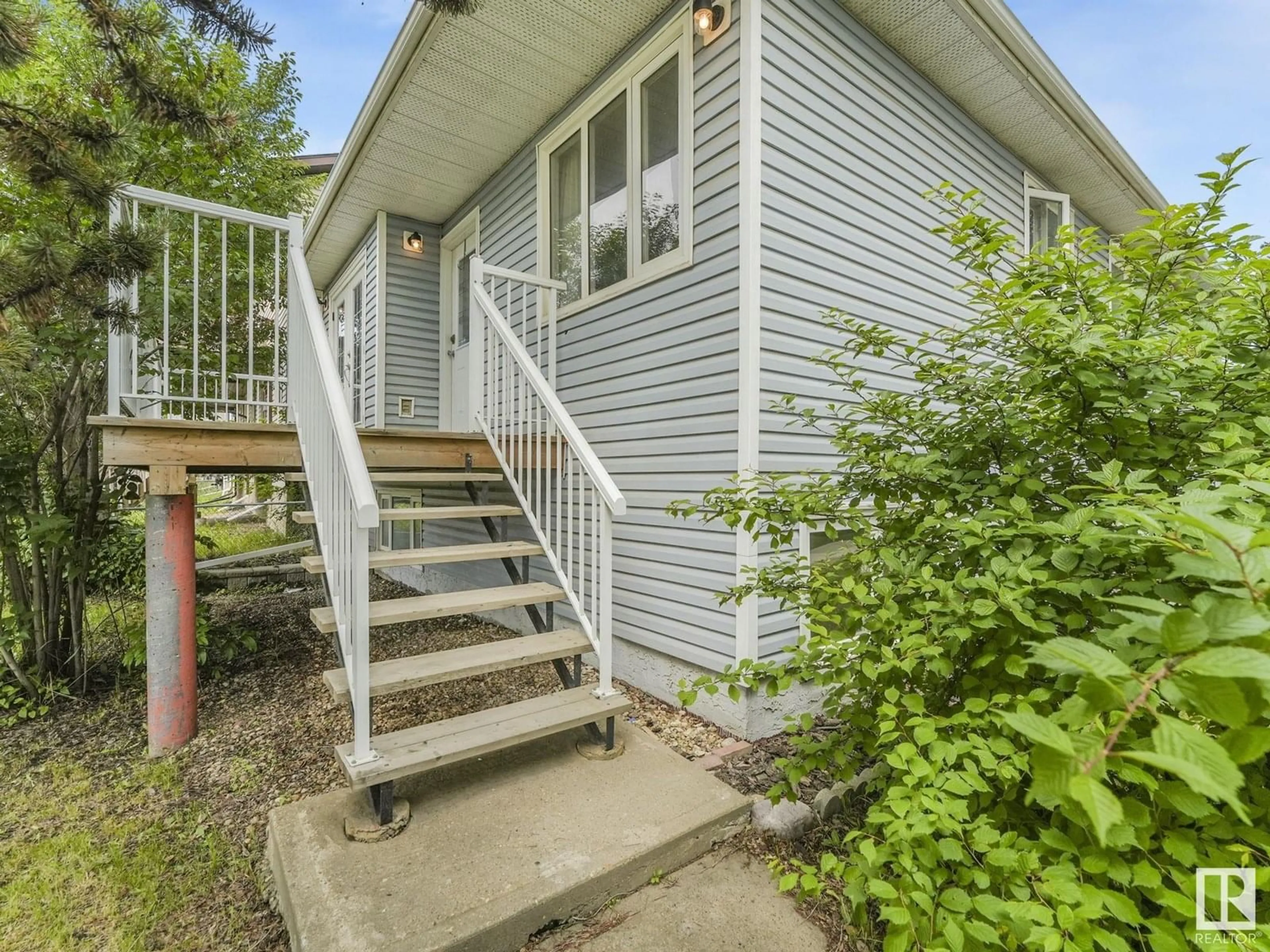 Home with vinyl exterior material, street for 11604 127 AV, Edmonton Alberta T5E0C8