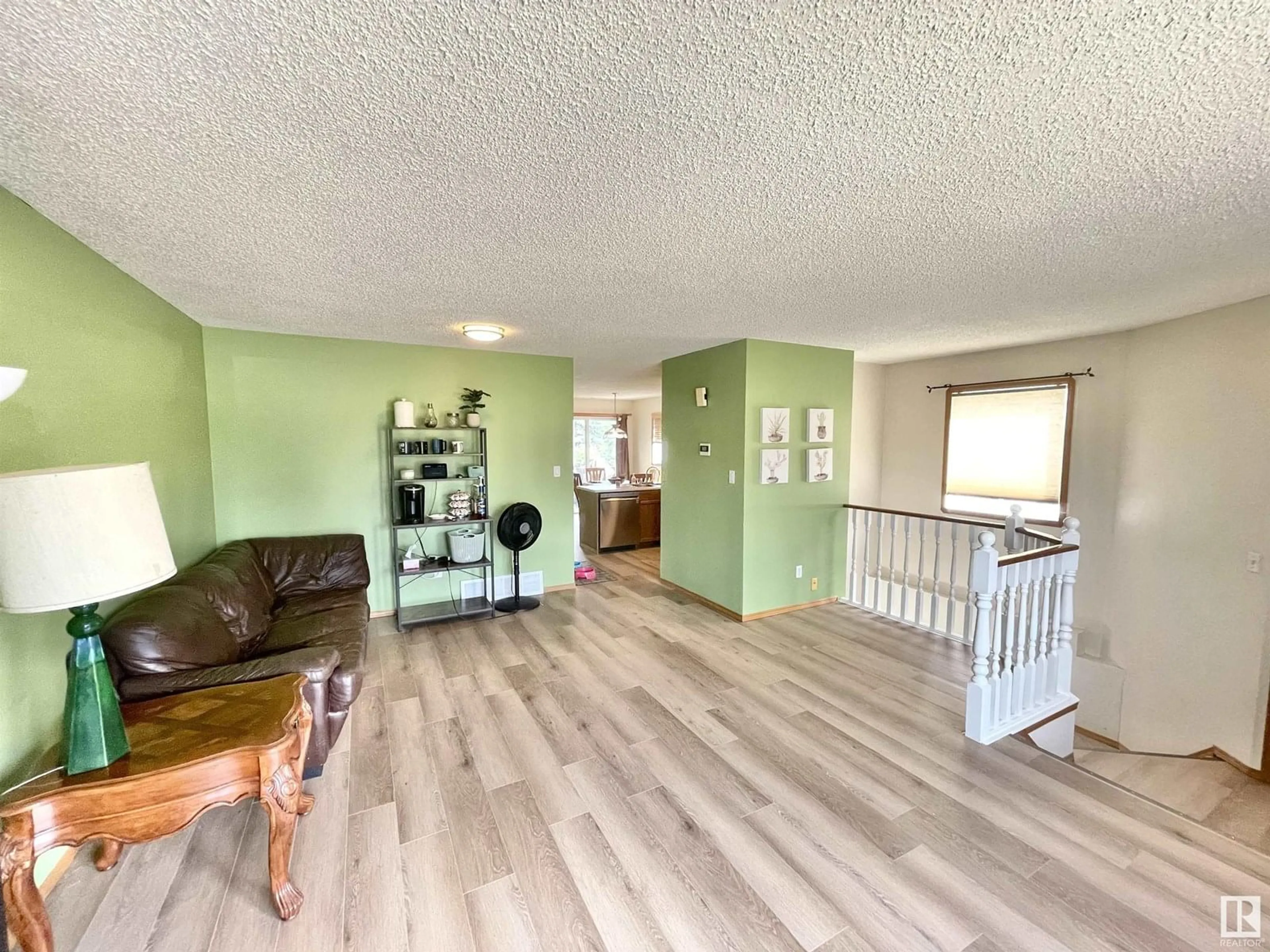 Living room with furniture, wood/laminate floor for 3508 44 AV, Edmonton Alberta T6L6K5