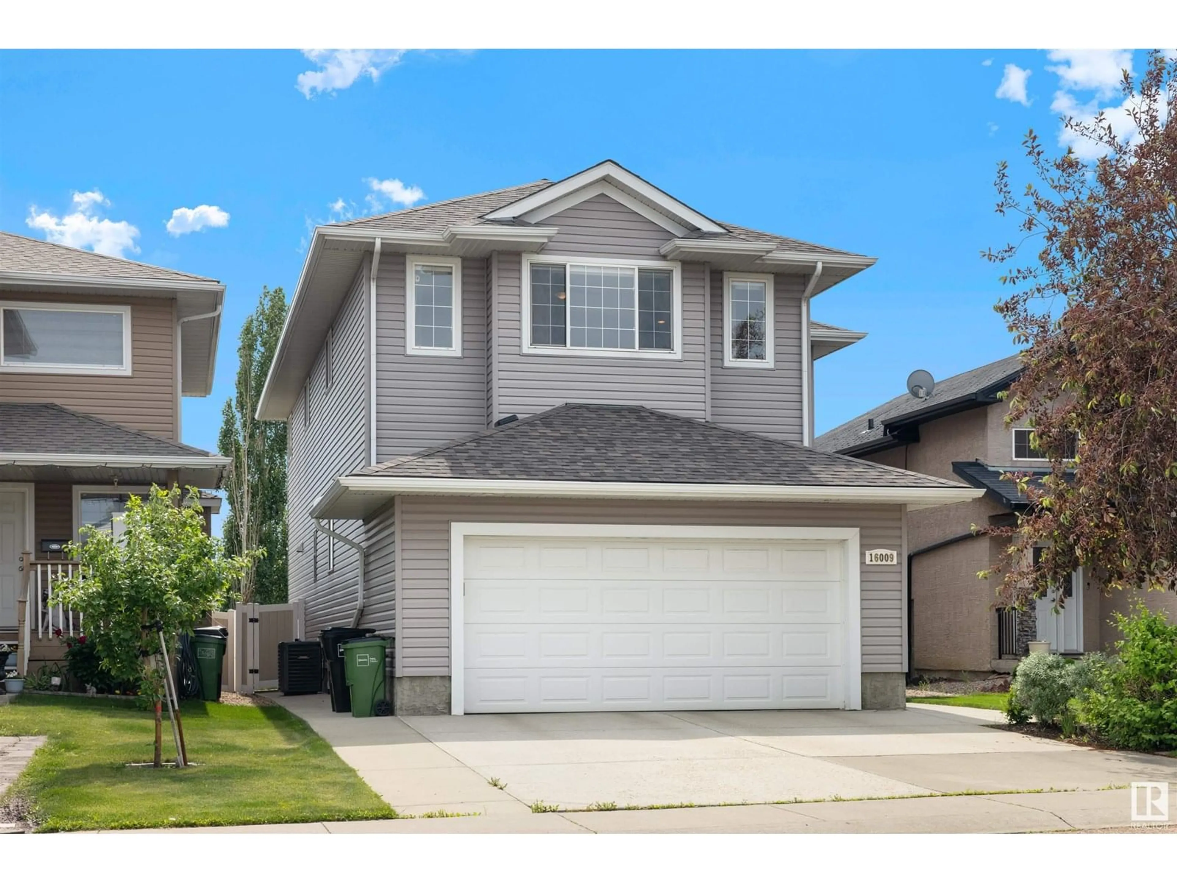 Home with vinyl exterior material, street for NW - 16009 49 ST, Edmonton Alberta T5Y0G7