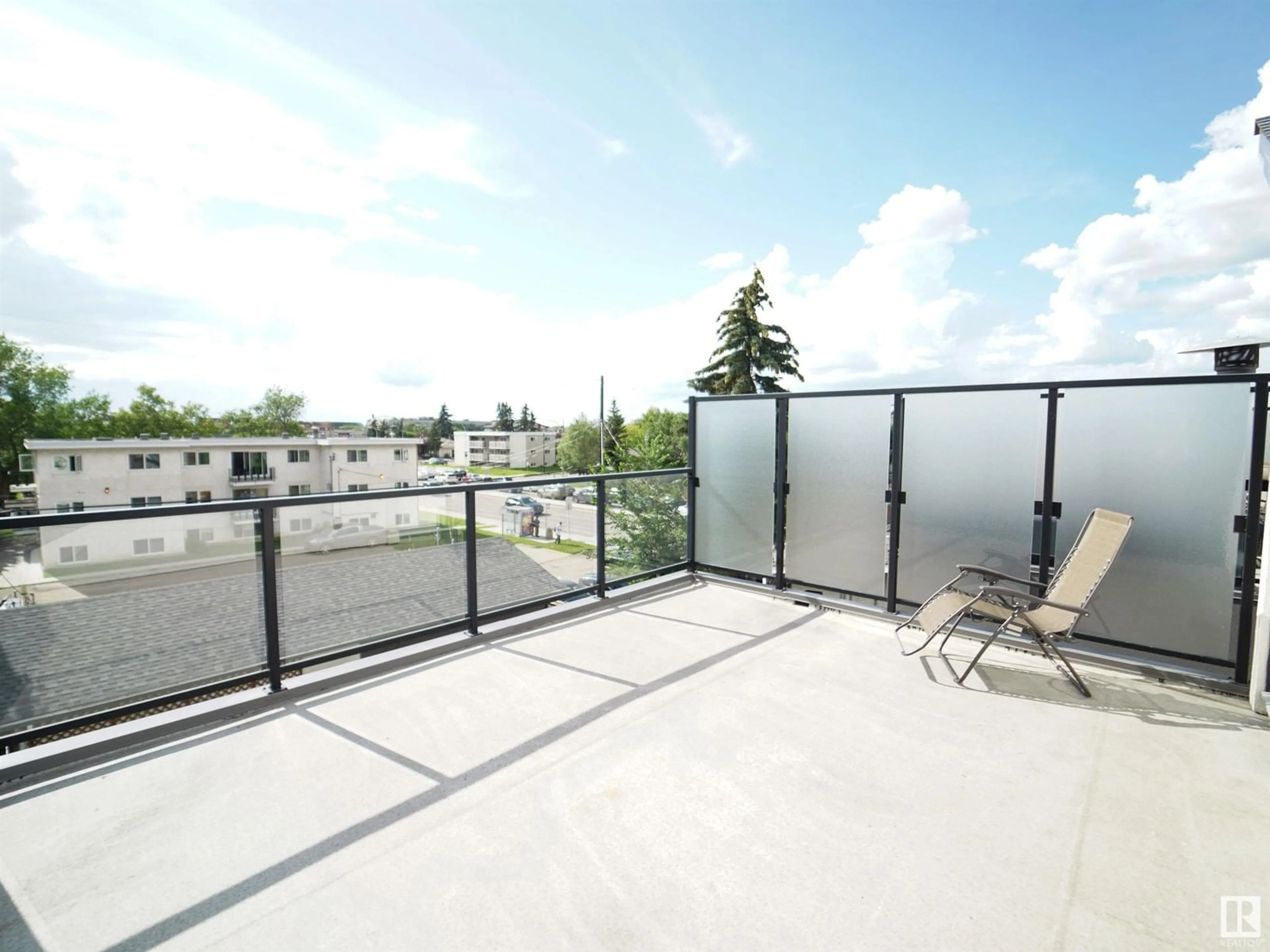 Patio, city buildings view from balcony for NW - 11042 131 ST, Edmonton Alberta T5M1B8