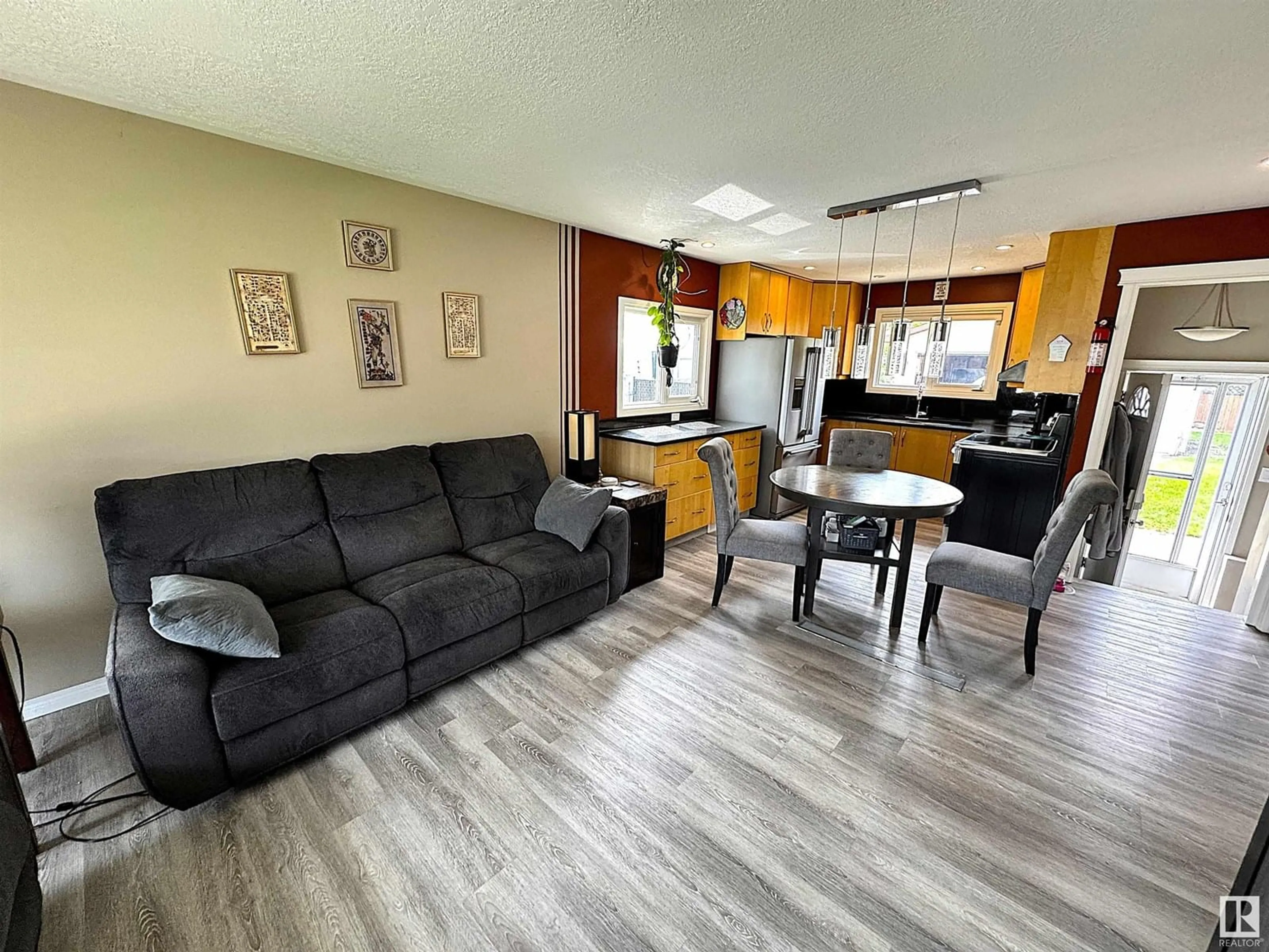 Living room with furniture, unknown for NW - 2019 145 AV, Edmonton Alberta T5Y1V1