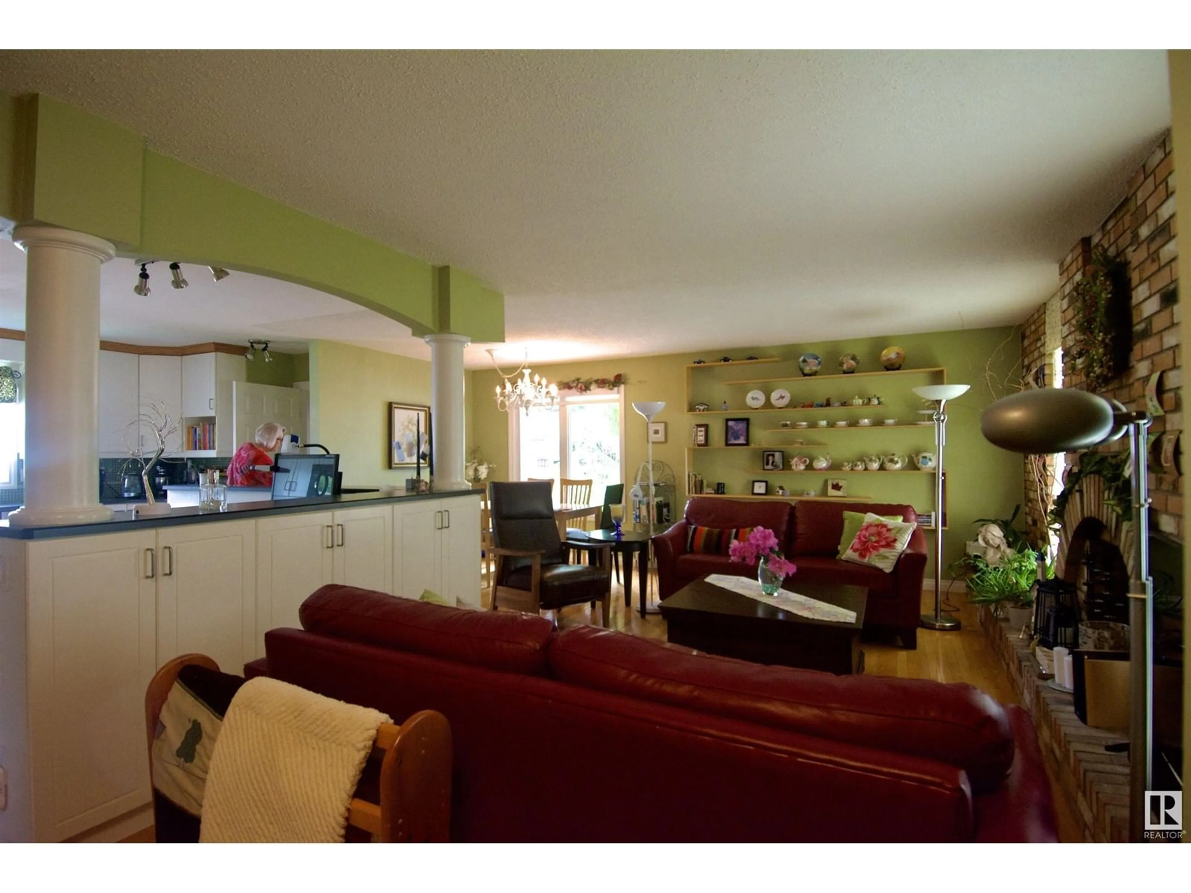 Living room with furniture, wood/laminate floor for 8516 42A AV, Edmonton Alberta T6K1S4