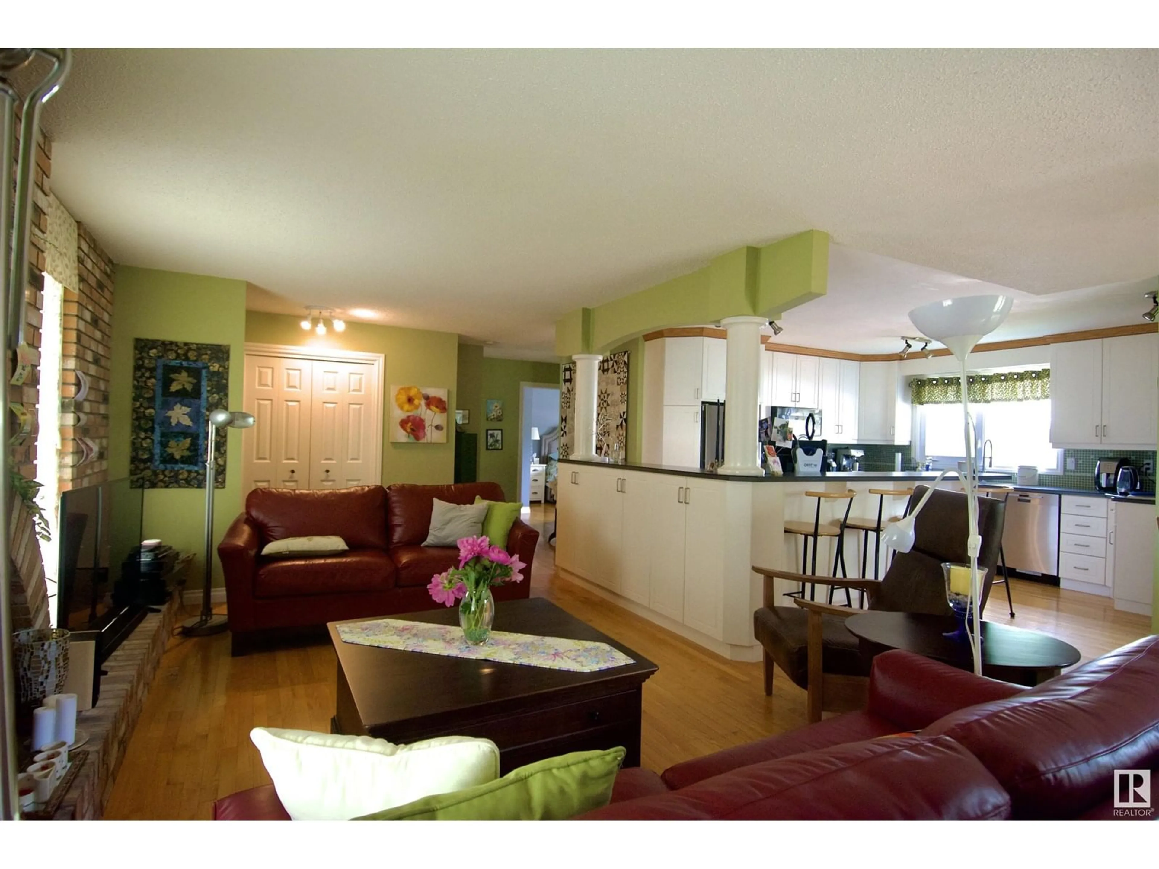 Living room with furniture, wood/laminate floor for 8516 42A AV, Edmonton Alberta T6K1S4