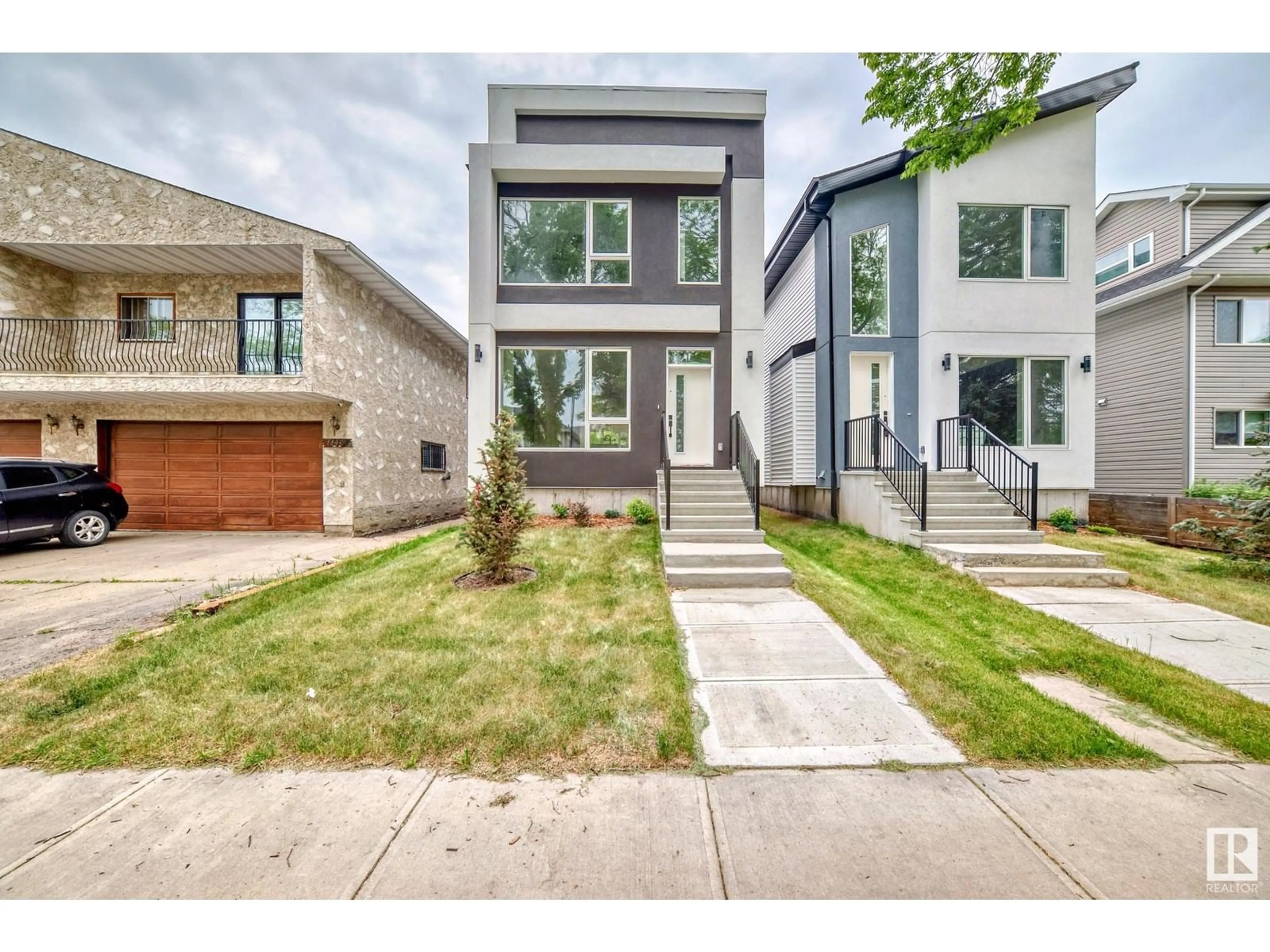 Home with brick exterior material, street for 11442 125 ST, Edmonton Alberta T5M0M9