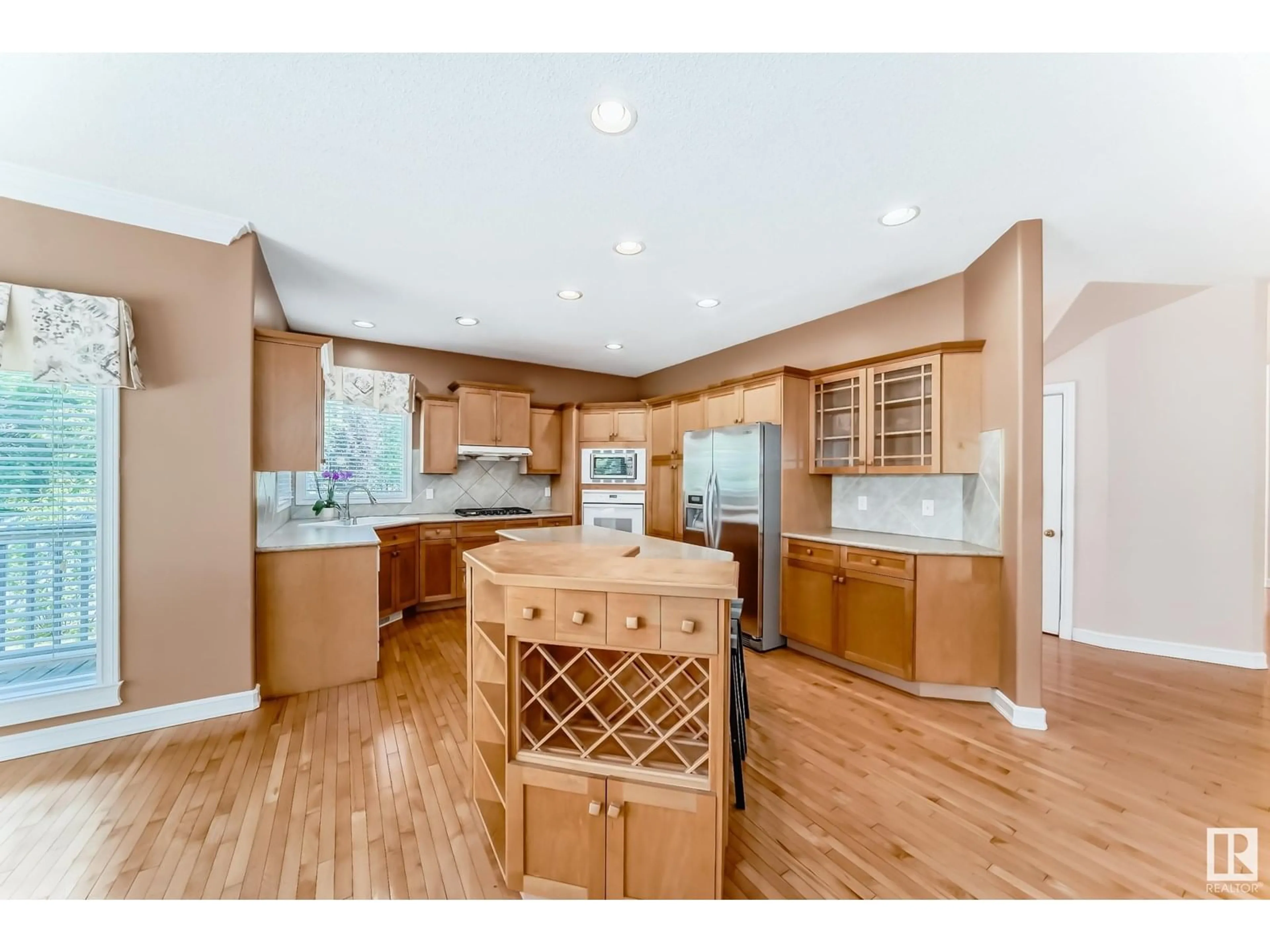 Open concept kitchen, wood/laminate floor for 318 DARLINGTON CR, Edmonton Alberta T6M2R9