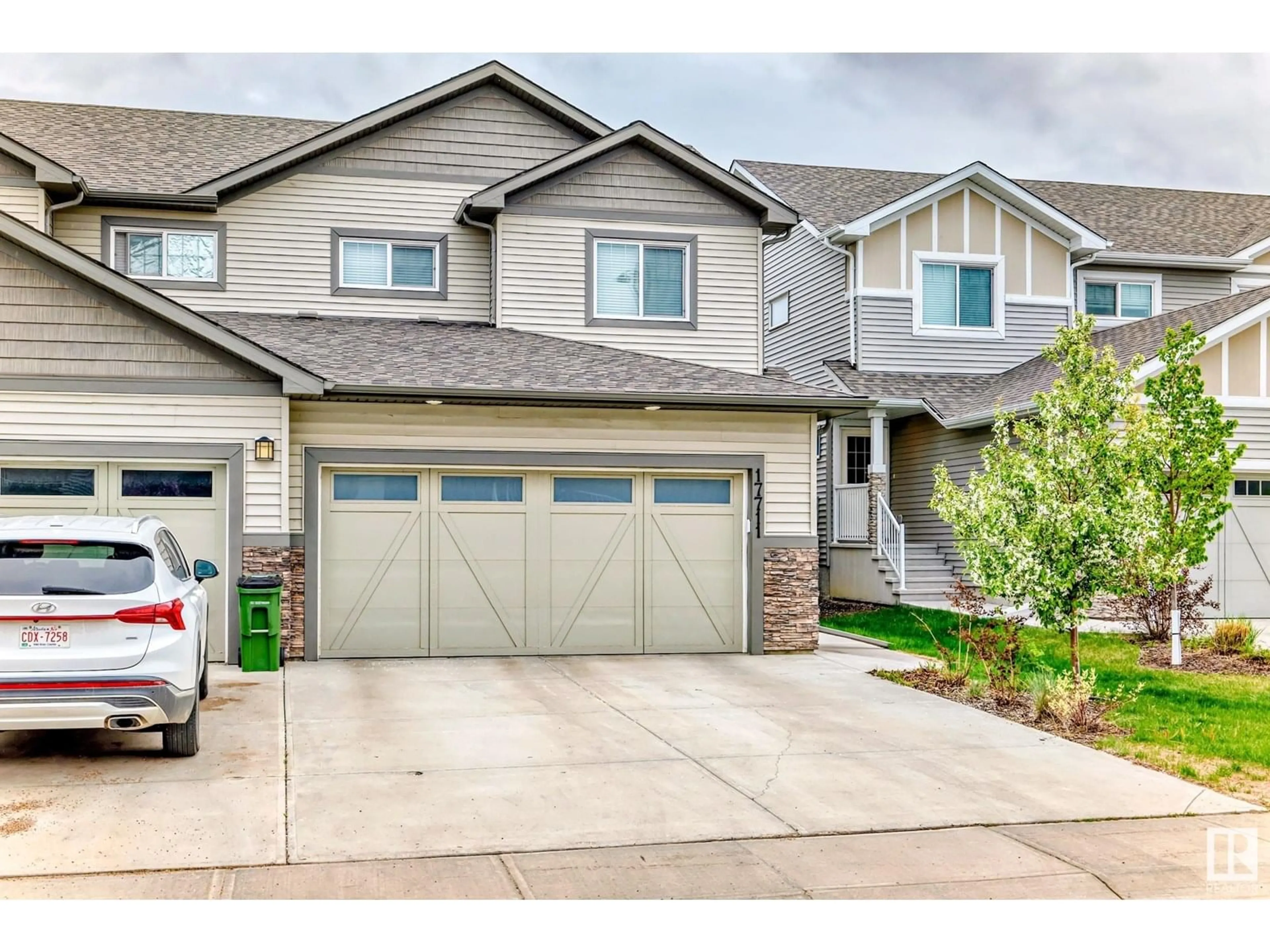 Home with vinyl exterior material, street for NW - 17711 64 AV, Edmonton Alberta T5Y3X4