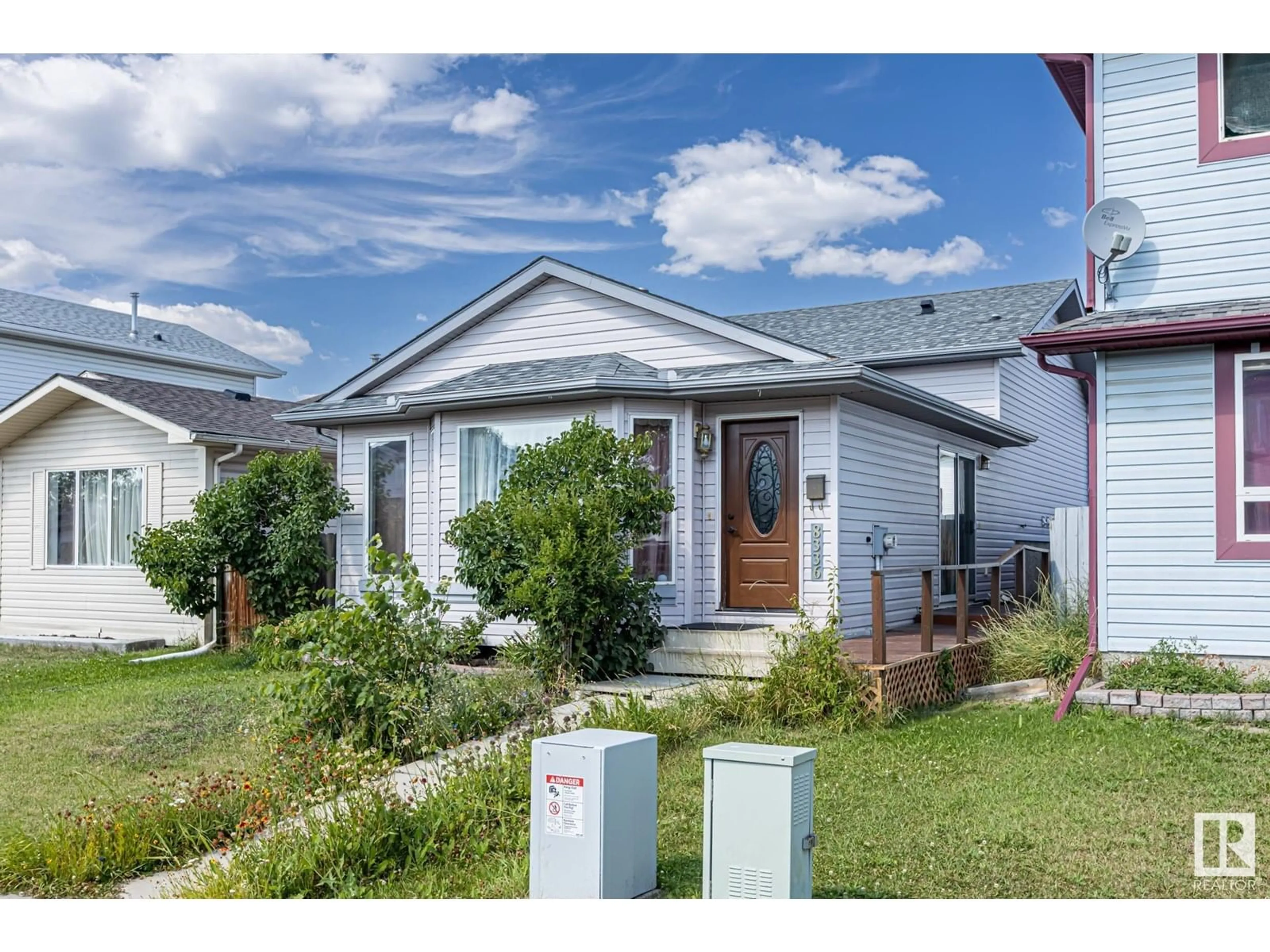 Home with vinyl exterior material, street for NW - 8336 159 AV, Edmonton Alberta T5Z3C8