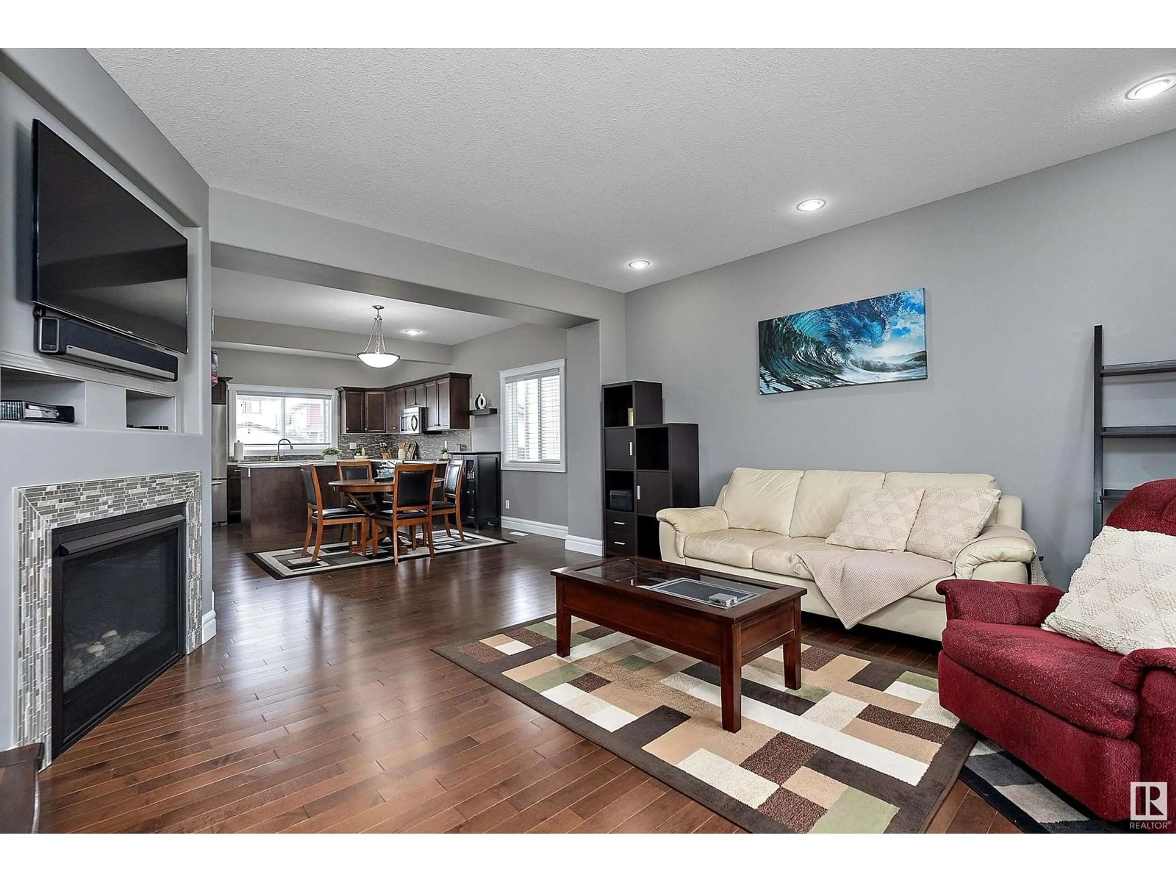 Living room with furniture, wood/laminate floor for 309 SHERIDAN WY, Leduc Alberta T9E8R9