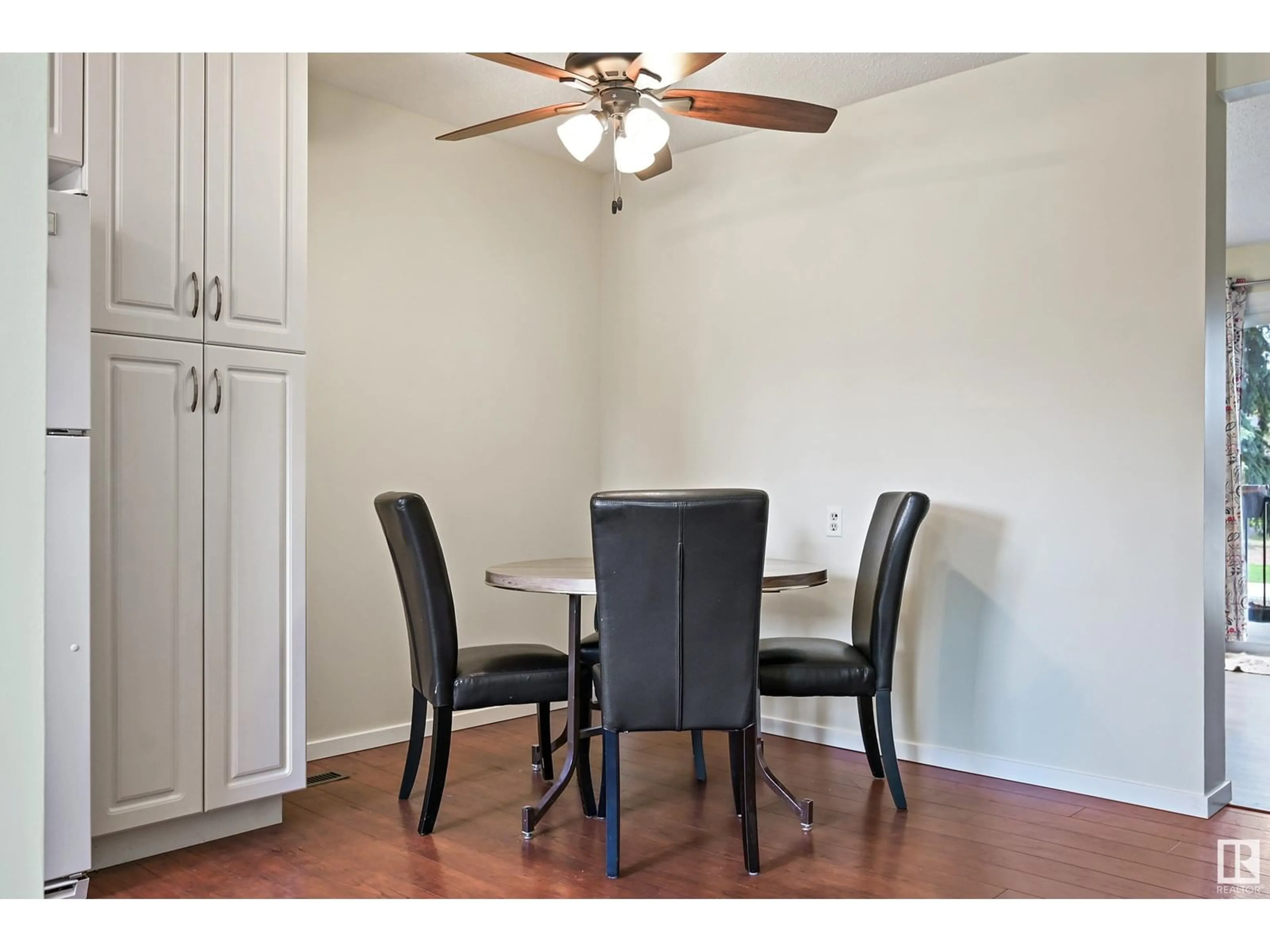 Dining room, wood/laminate floor for 9945 171 AV, Edmonton Alberta T5X4X2