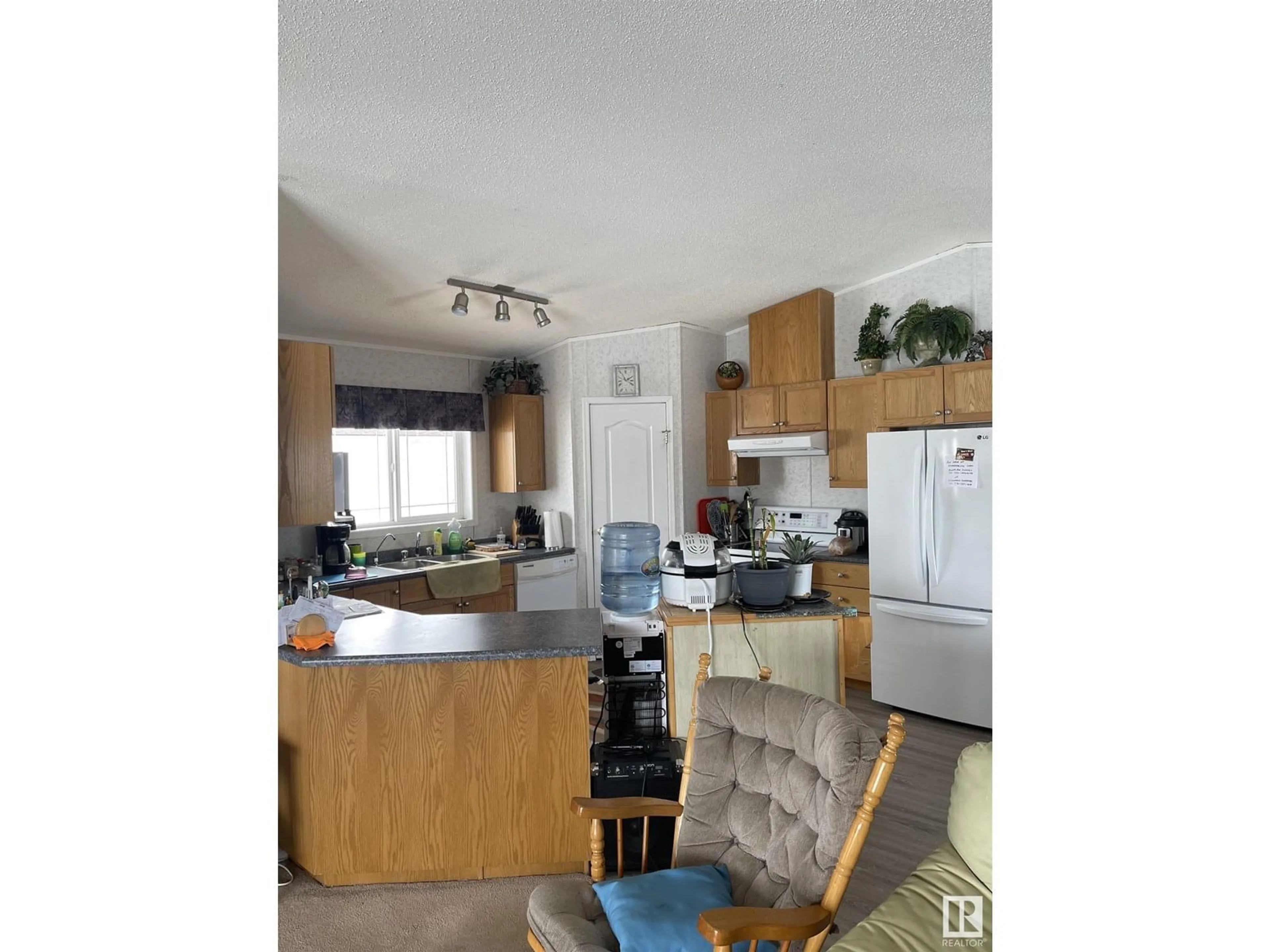 Open concept kitchen, wood/laminate floor for 6 - 3401 STE. ANNE TR, Rural Lac Ste. Anne County Alberta T0E0A1