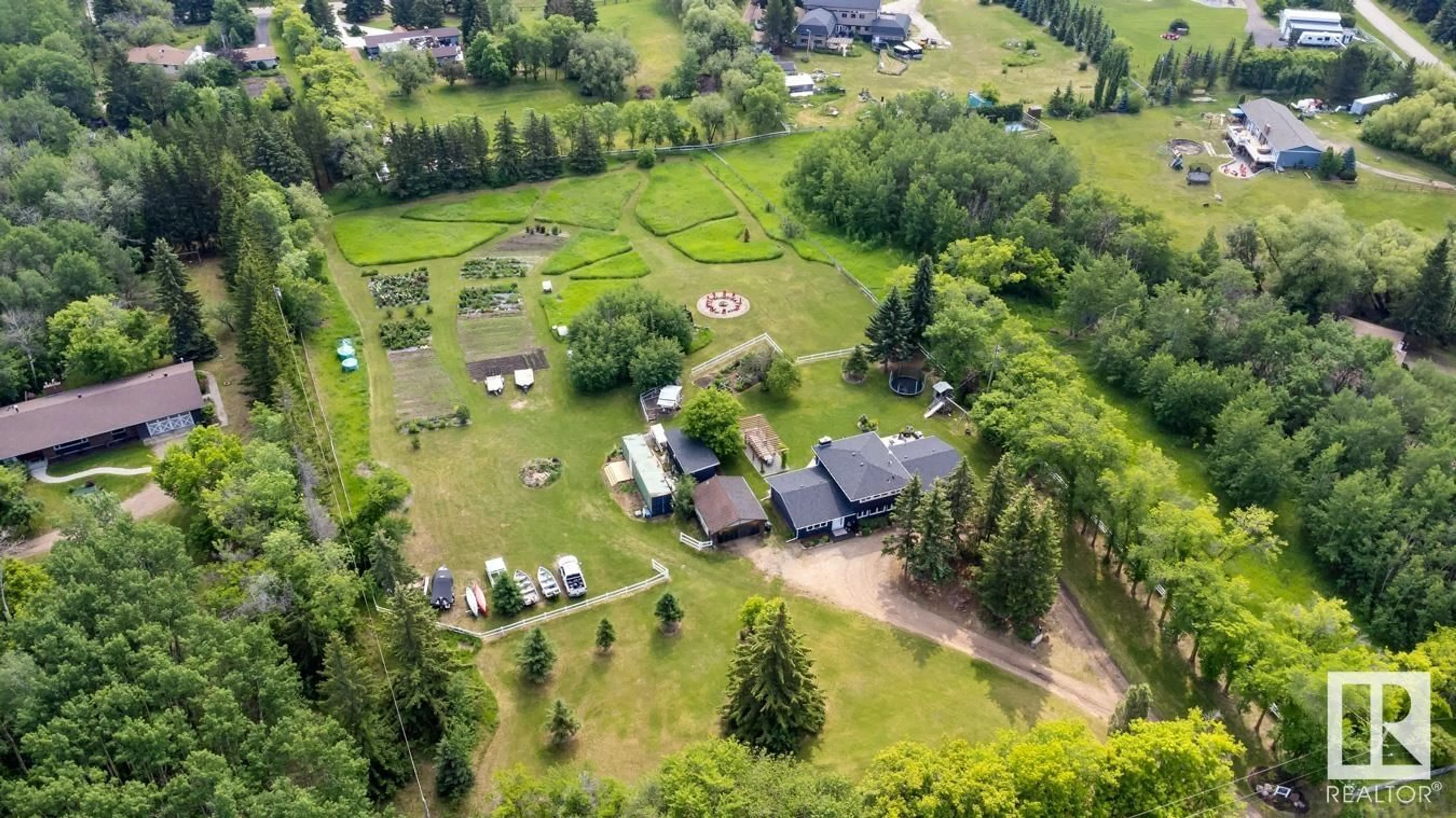 A pic from outside/outdoor area/front of a property/back of a property/a pic from drone, unknown for 22560 - 523 WYE RD, Rural Strathcona County Alberta T8A4T6