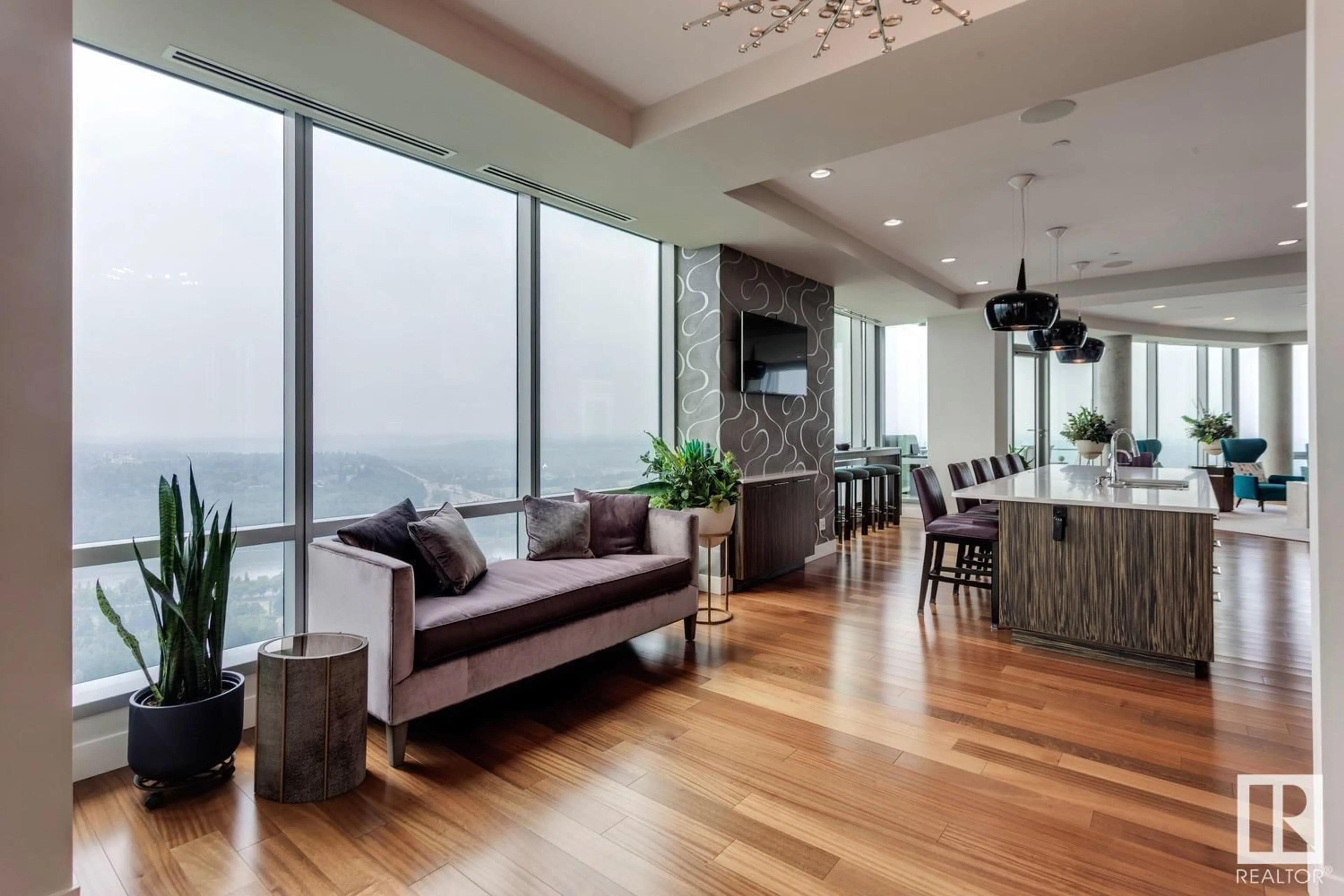 Living room with furniture, wood/laminate floor for 3001 JASPER AV, Edmonton Alberta T5K0P1