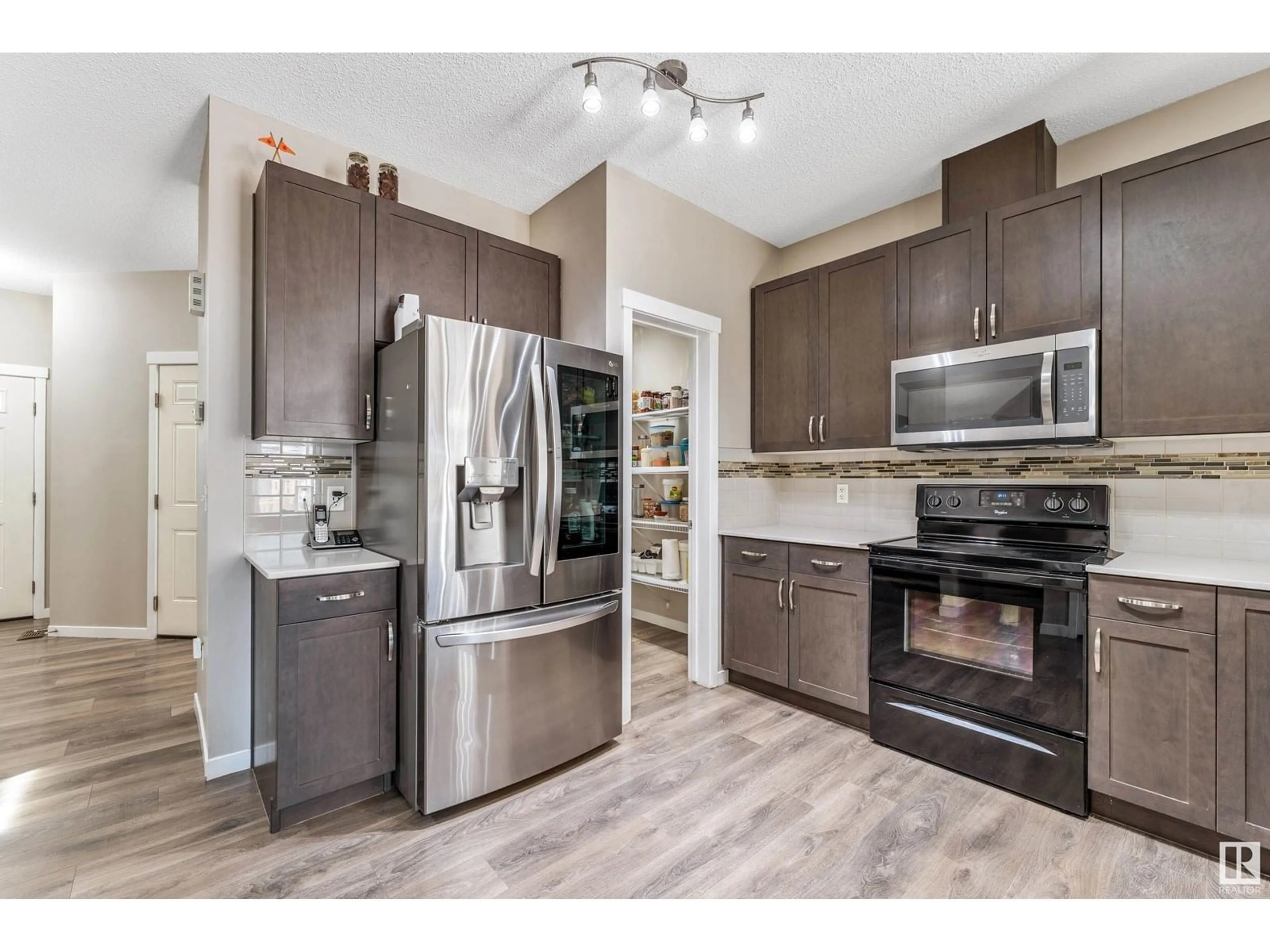 Open concept kitchen, unknown for NW - 1307 29 ST, Edmonton Alberta T6T0G7