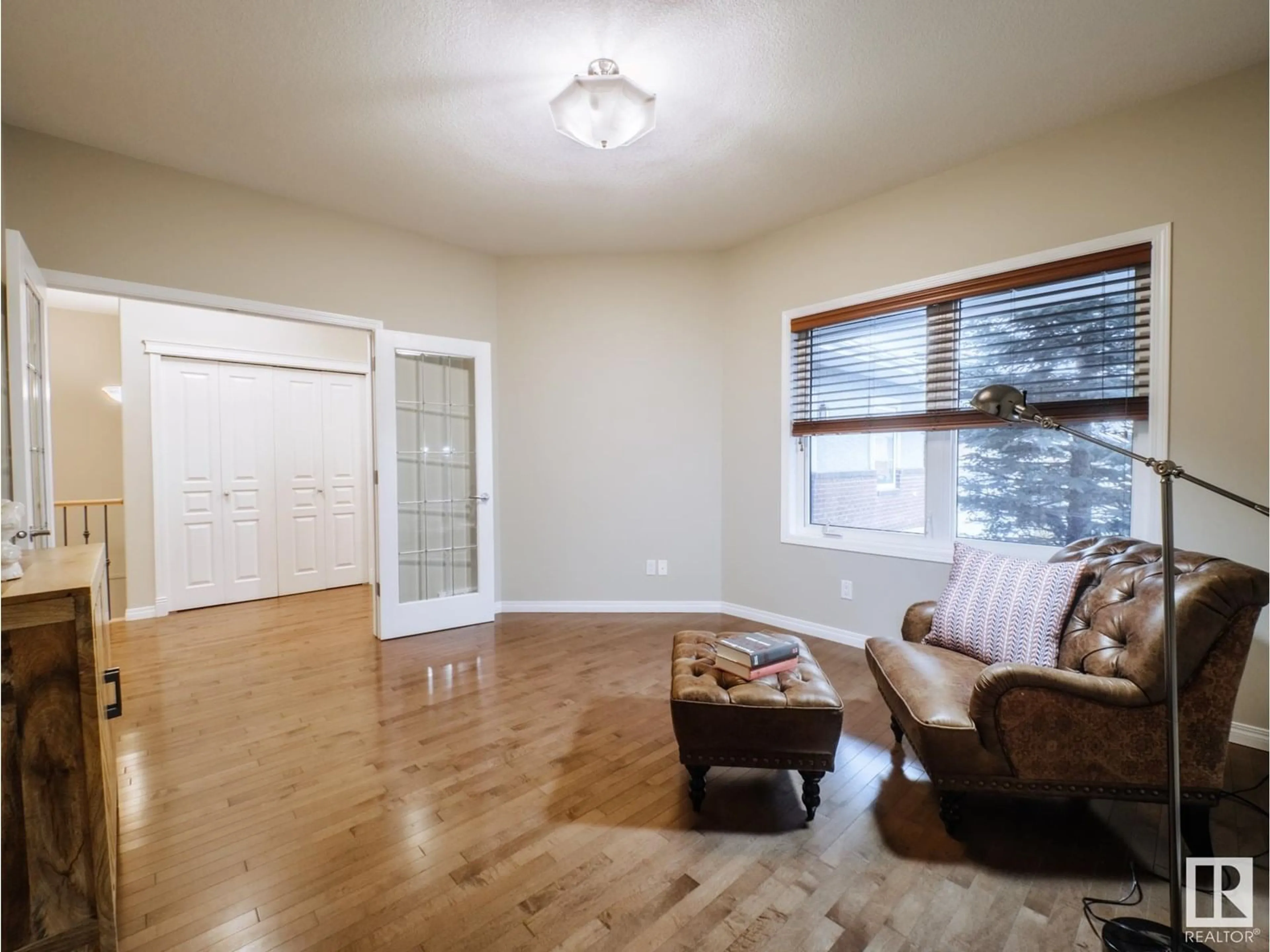 Living room with furniture, wood/laminate floor for 18343 LESSARD RD, Edmonton Alberta T6M0A2