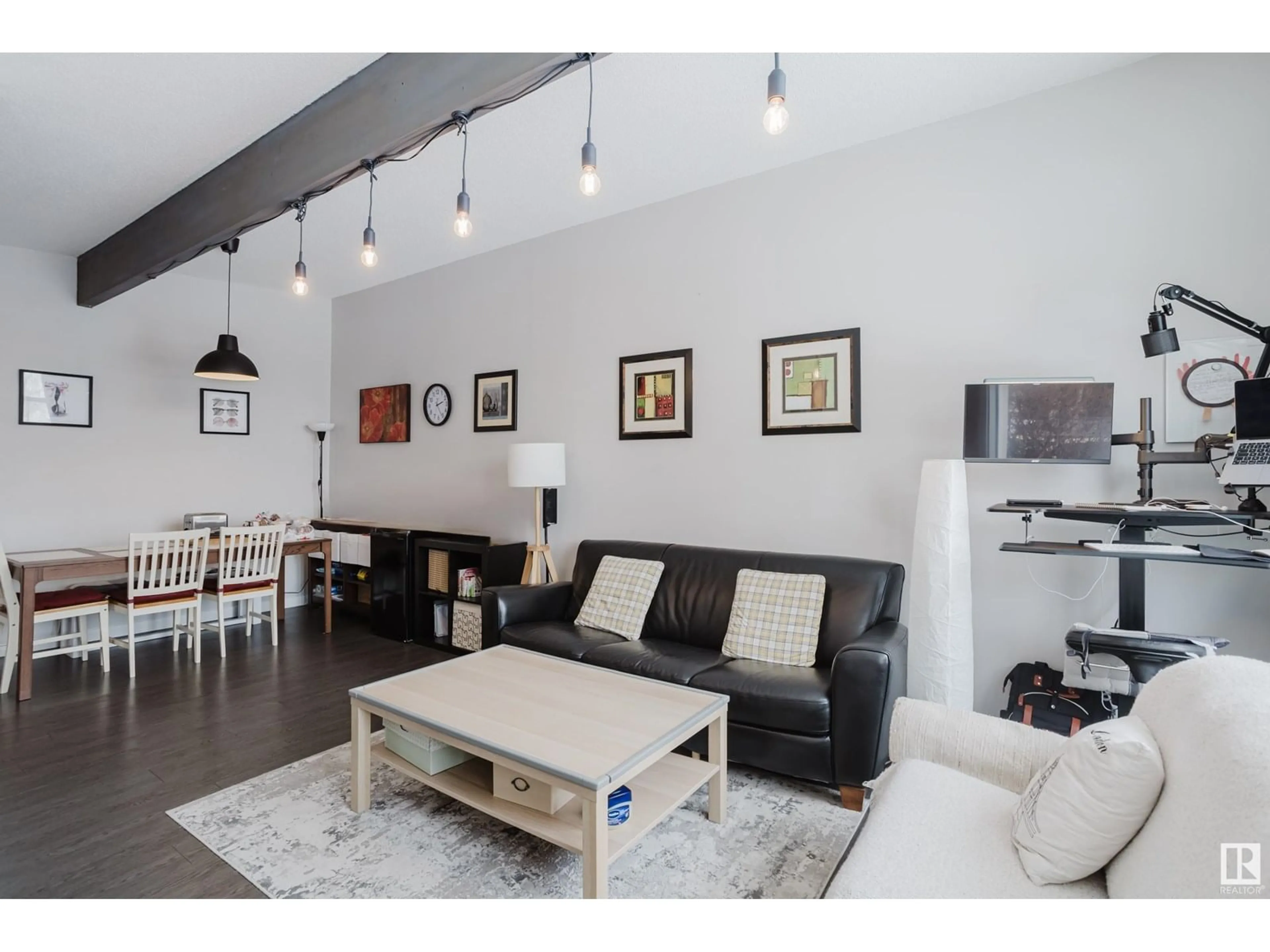 Living room with furniture, wood/laminate floor for NW - 8123 8125 83 AV, Edmonton Alberta T6C1A7