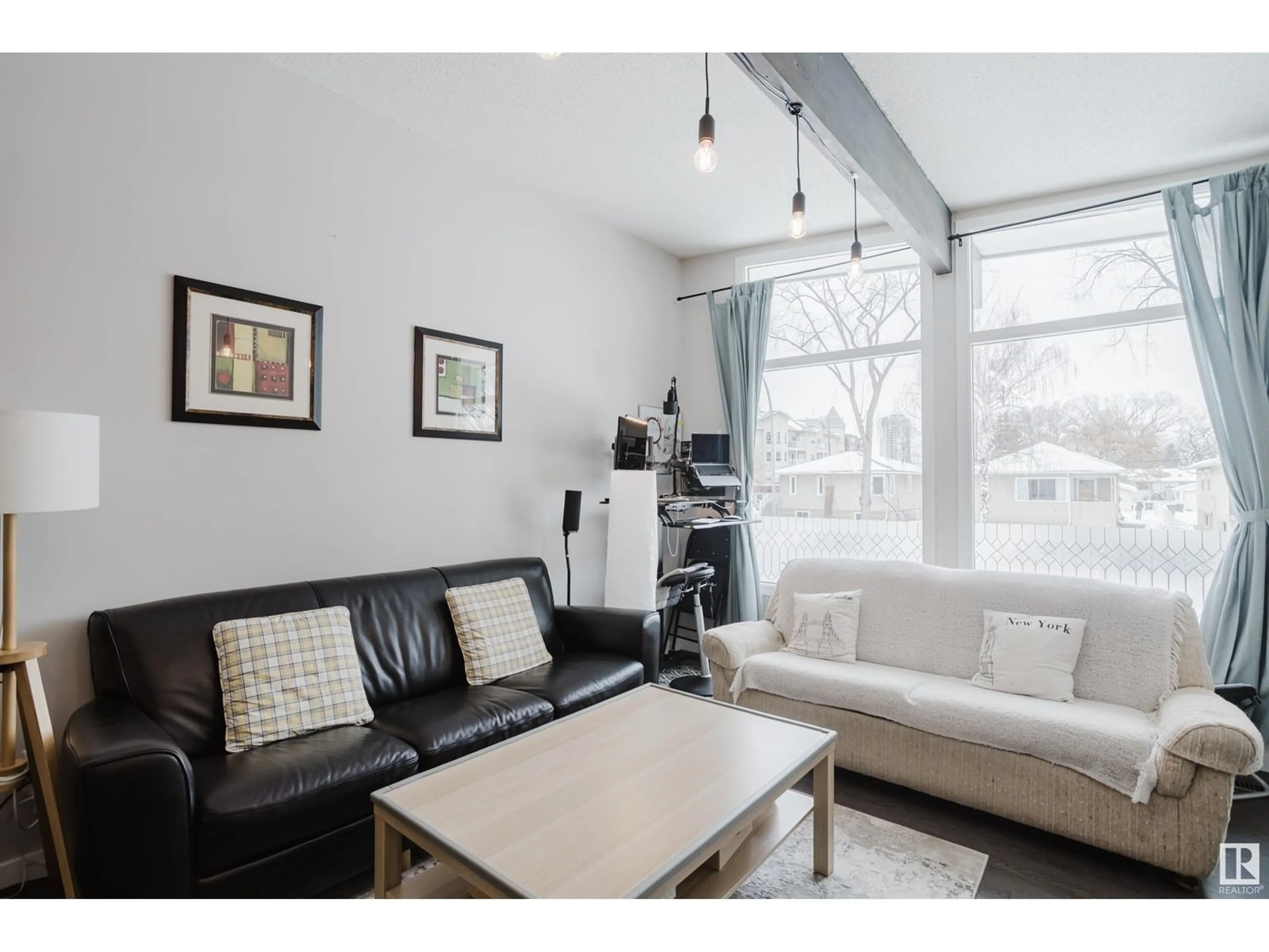 Living room with furniture, wood/laminate floor for NW - 8123 8125 83 AV, Edmonton Alberta T6C1A7