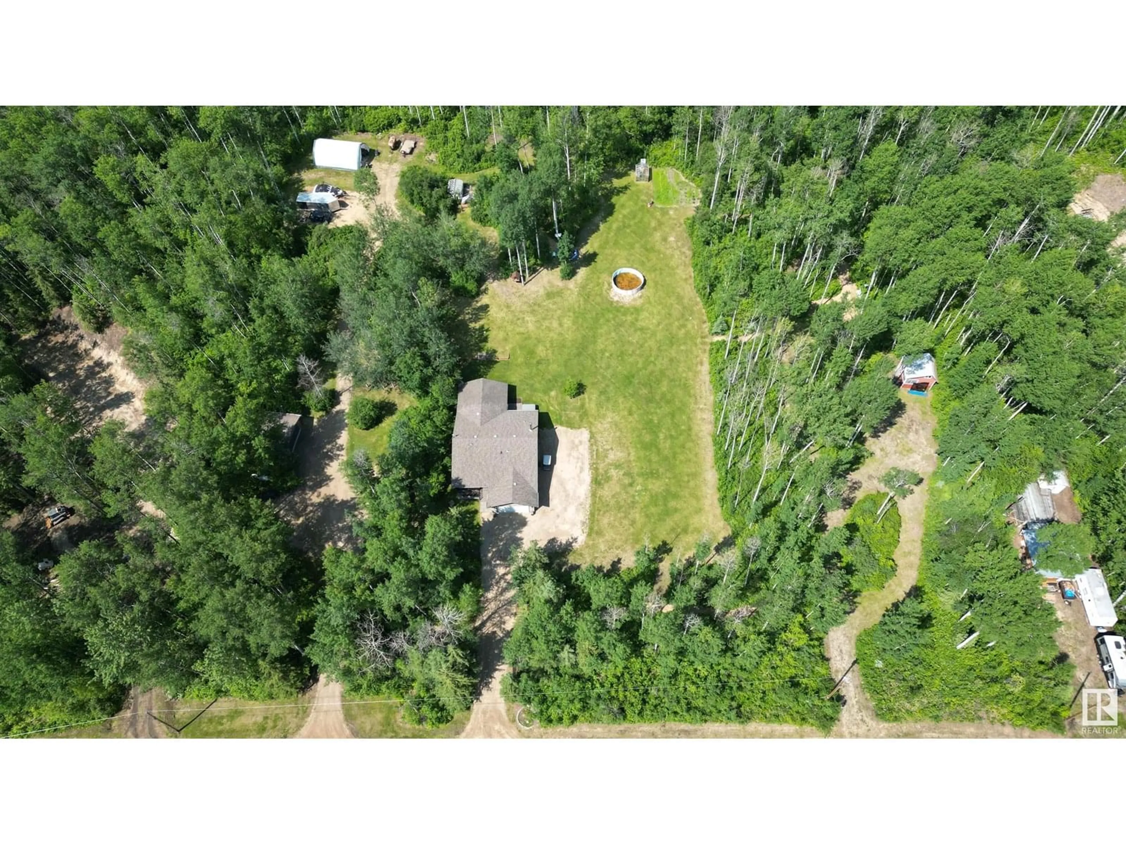 A pic from outside/outdoor area/front of a property/back of a property/a pic from drone, forest/trees view for 59316 - 16 RGE RD 54, Rural Barrhead County Alberta T0E1Y0