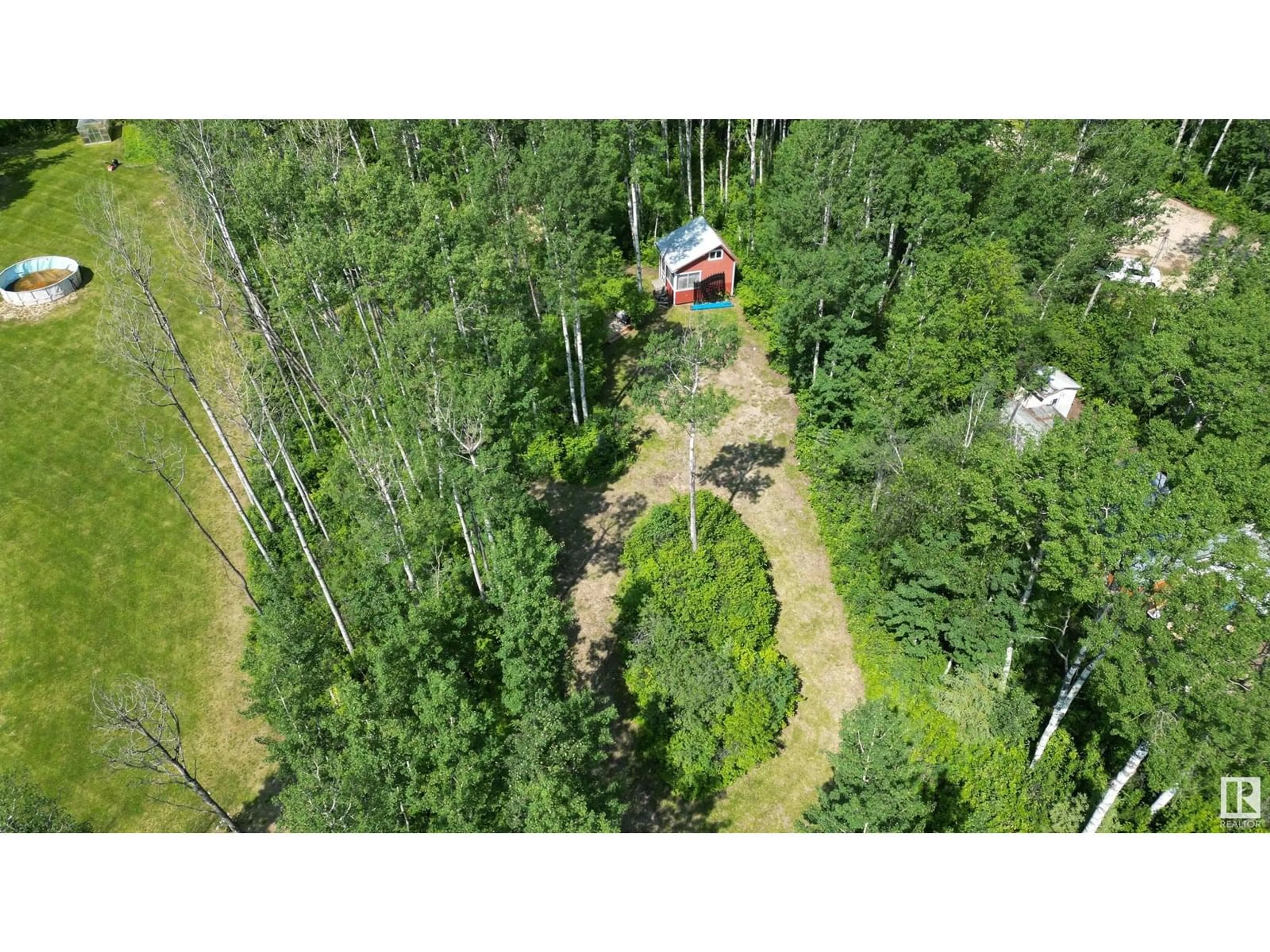A pic from outside/outdoor area/front of a property/back of a property/a pic from drone, forest/trees view for 59316 - 16 RGE RD 54, Rural Barrhead County Alberta T0E1Y0