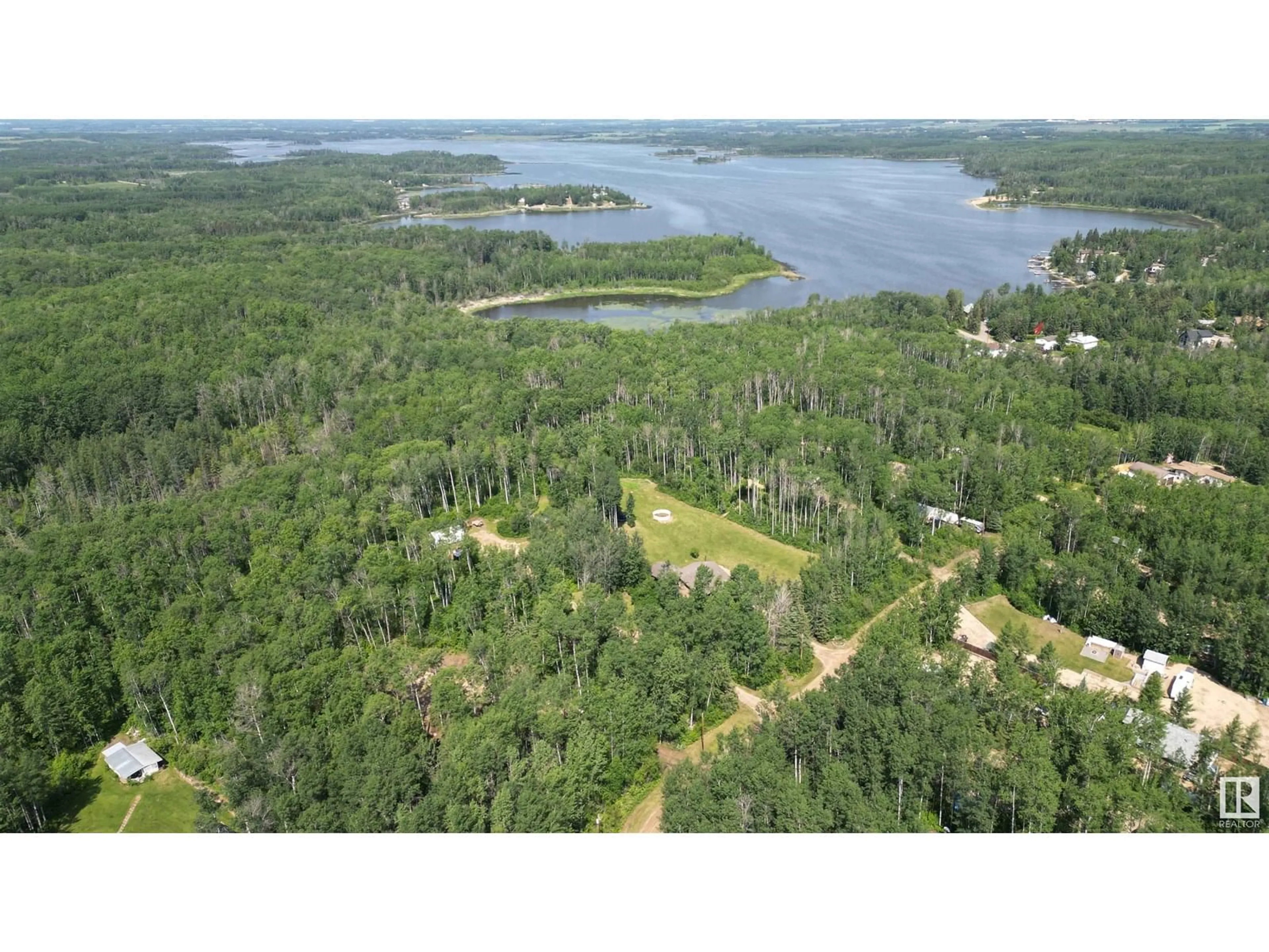 A pic from outside/outdoor area/front of a property/back of a property/a pic from drone, water/lake/river/ocean view for 59316 - 16 RGE RD 54, Rural Barrhead County Alberta T0E1Y0