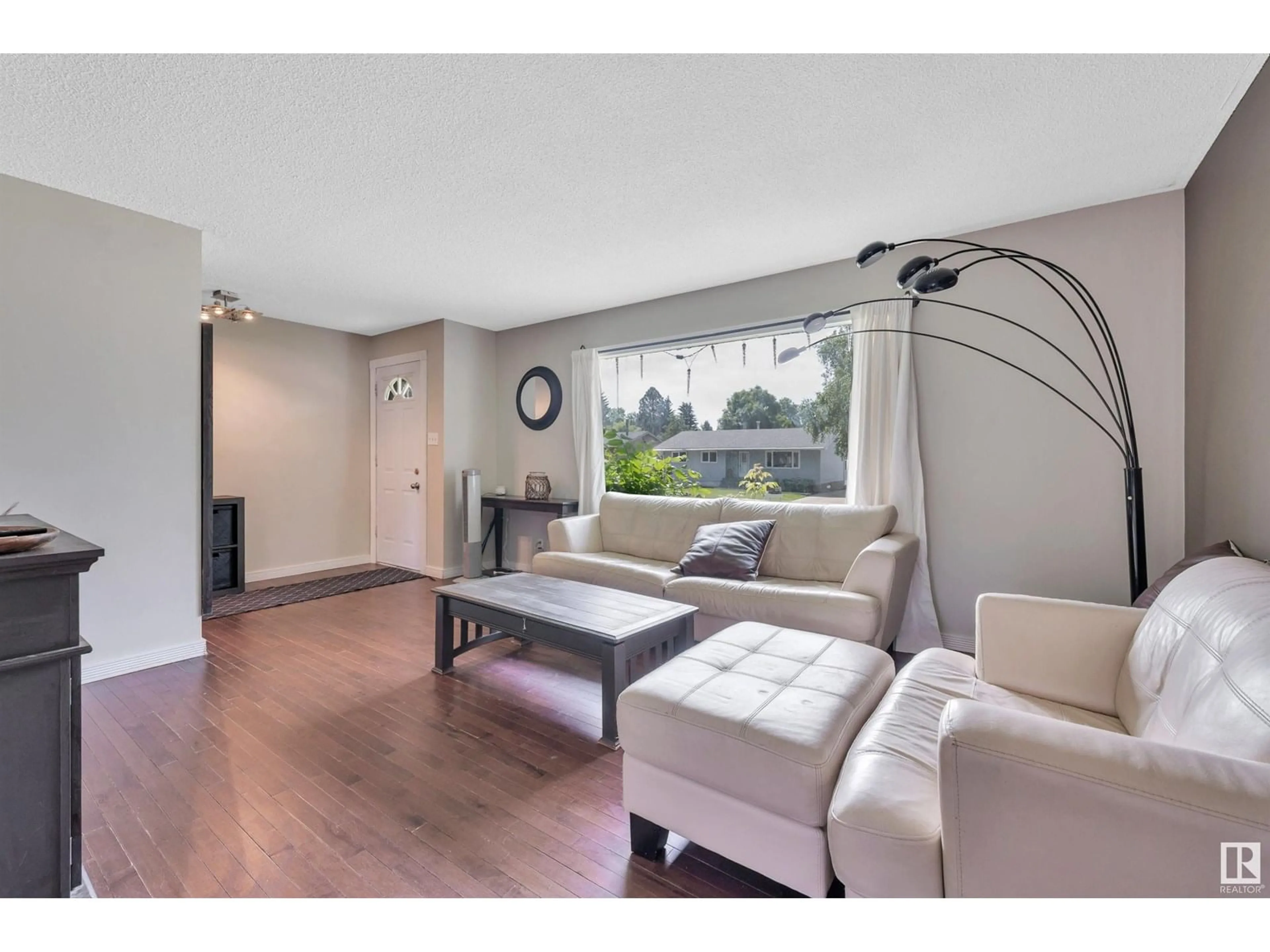 Living room with furniture, wood/laminate floor for 16 LARK ST, Sherwood Park Alberta T8A0J3