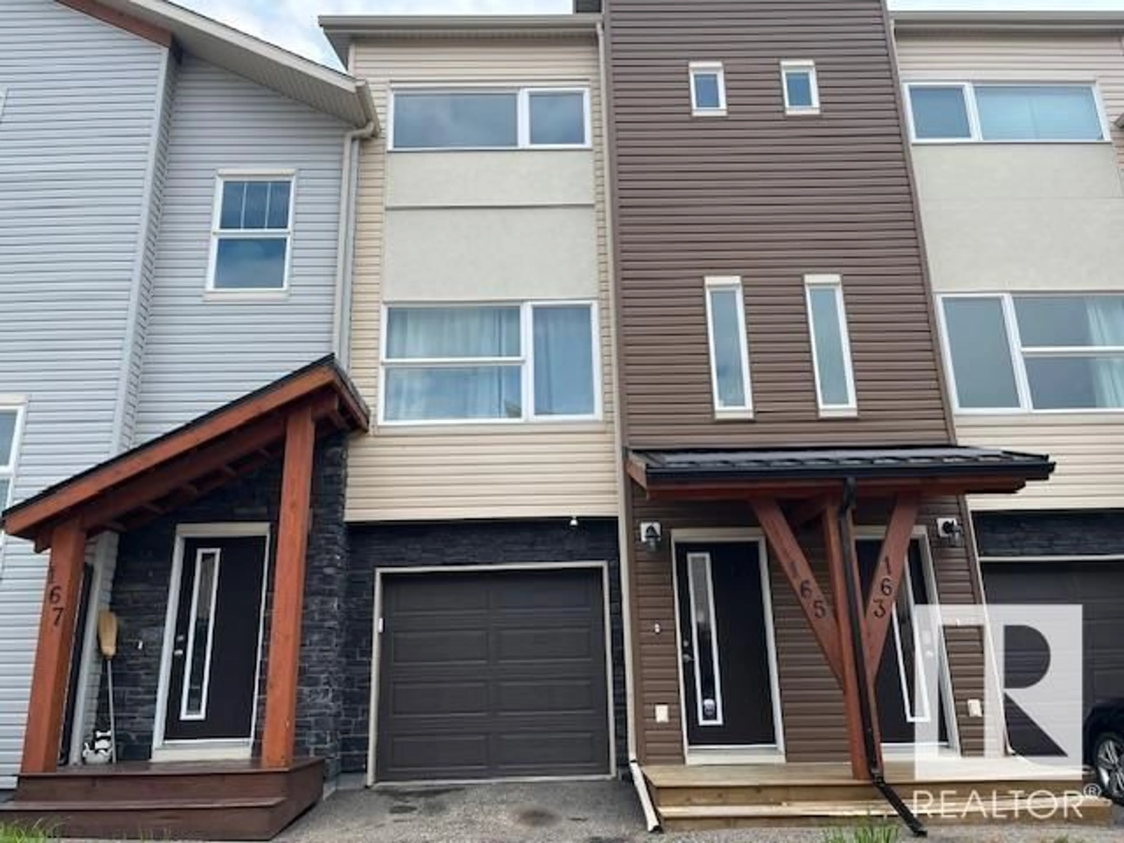 Home with vinyl exterior material, street for 401 - 165 SOUTHFORK DR, Leduc Alberta T9E0X1
