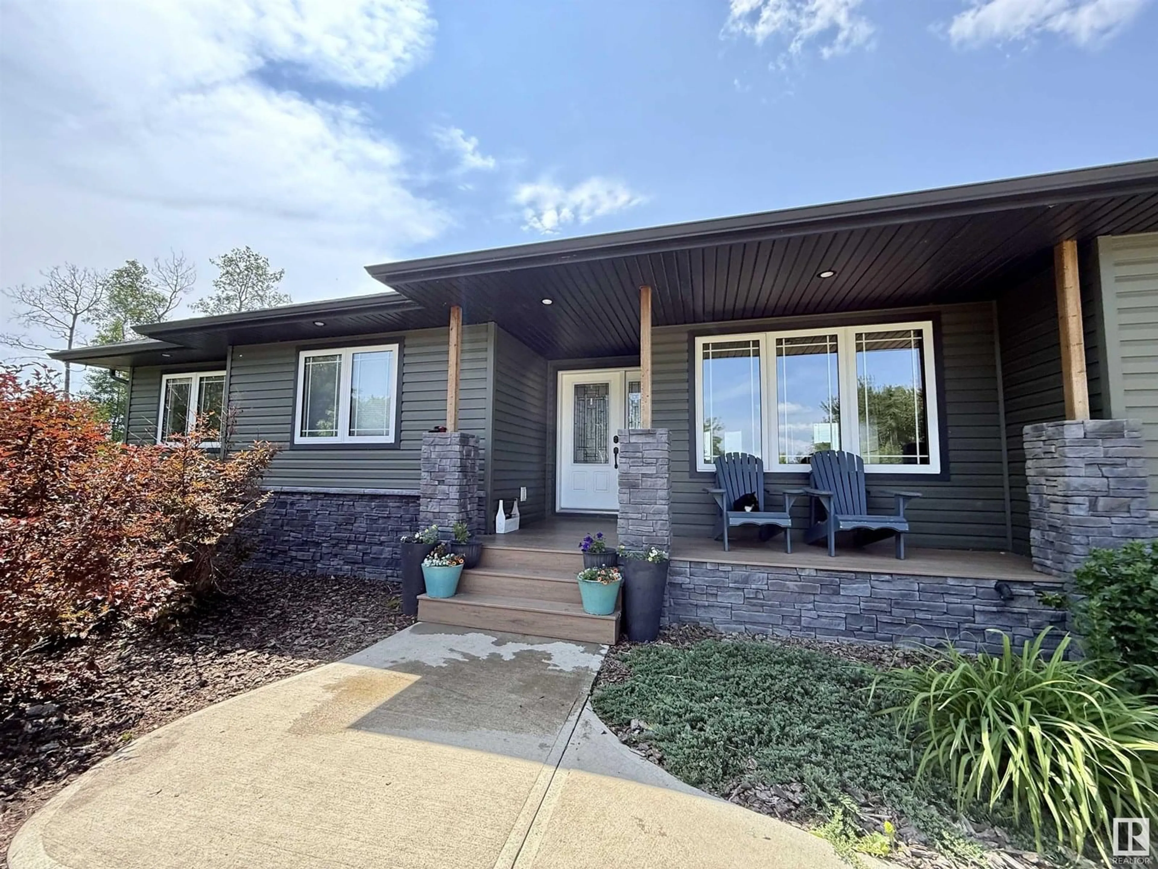 Home with vinyl exterior material, street for 10501 TWP RD 590, Rural St. Paul County Alberta T0A3A0