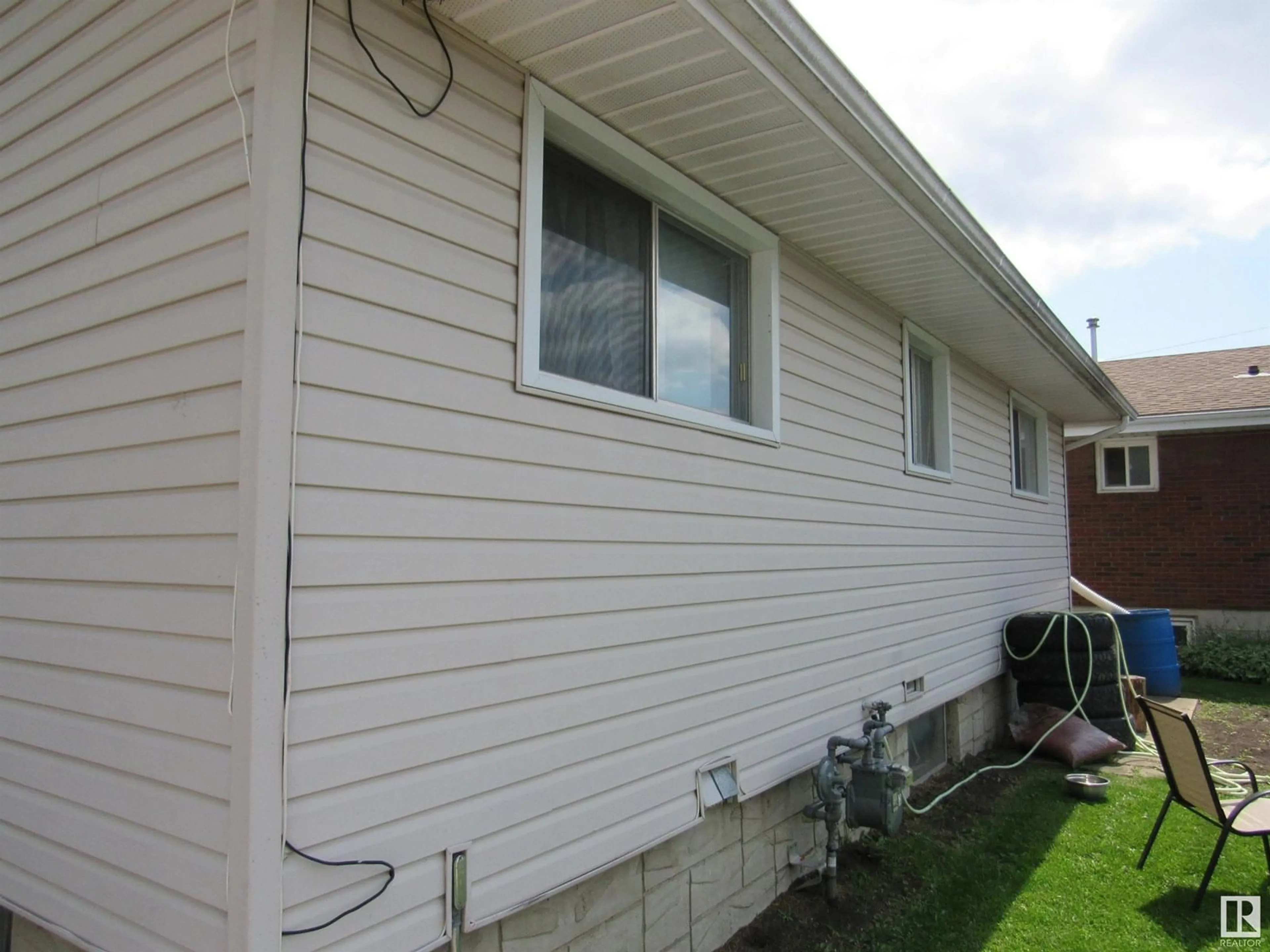Home with vinyl exterior material, building for 5006 53 ST, Barrhead Alberta T7N1L1