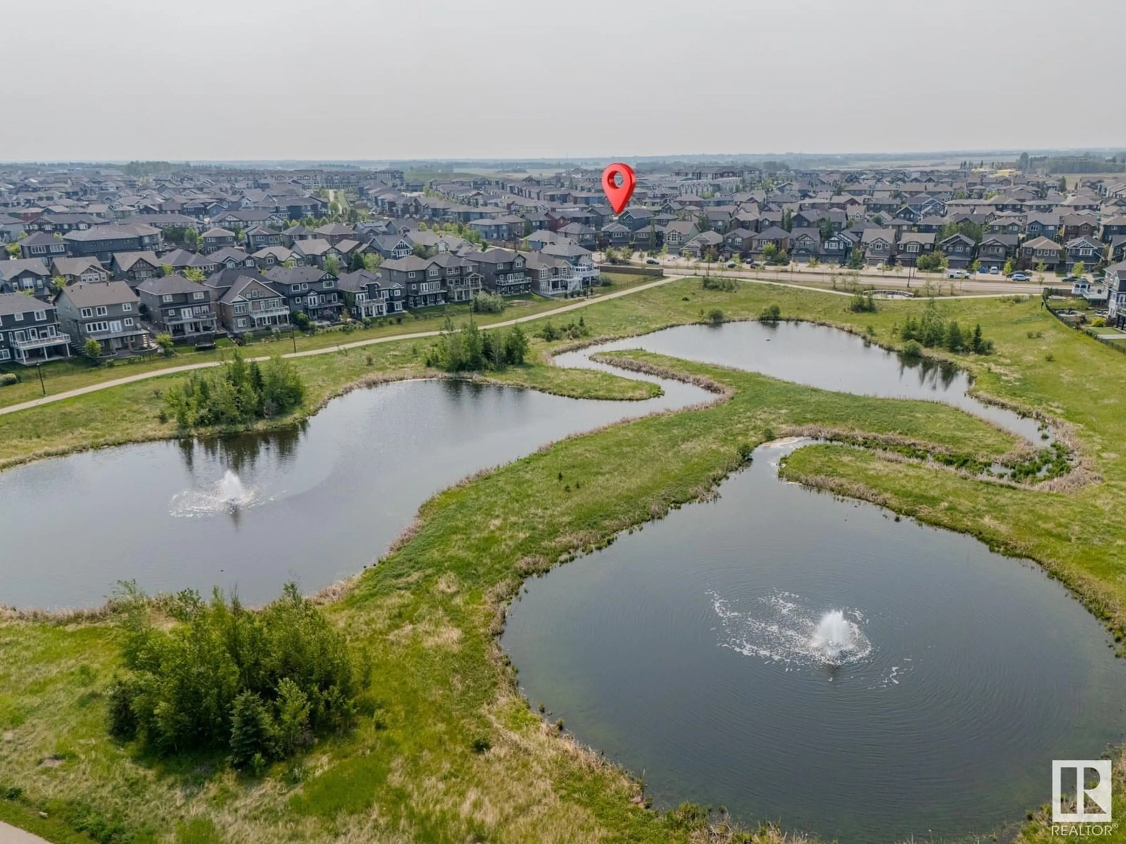 A pic from outside/outdoor area/front of a property/back of a property/a pic from drone, water/lake/river/ocean view for SW - 3015 WINSPEAR CM, Edmonton Alberta T6X1P4