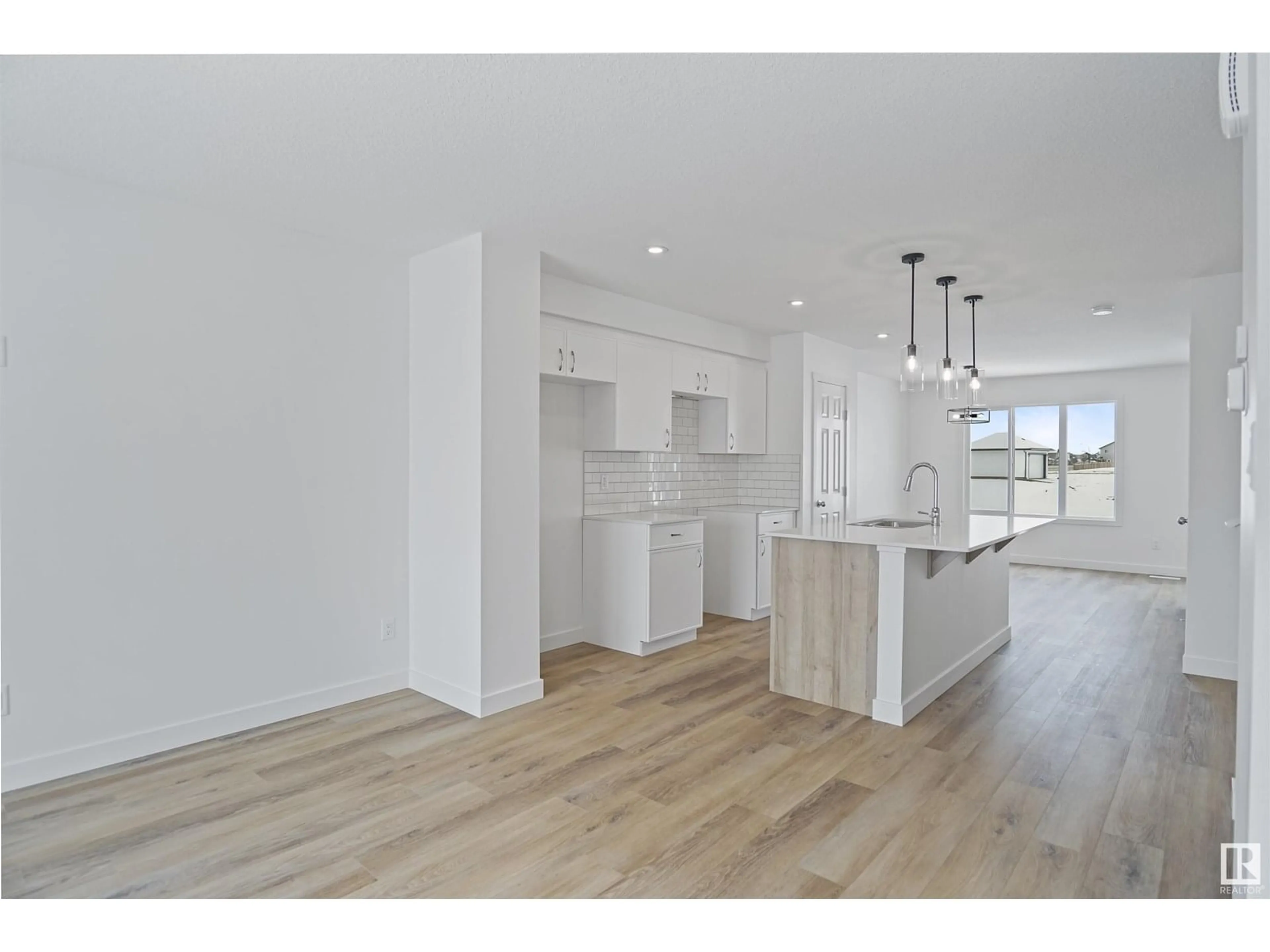 Open concept kitchen, wood/laminate floor for 53 FICUS WY, Fort Saskatchewan Alberta T8L4M1