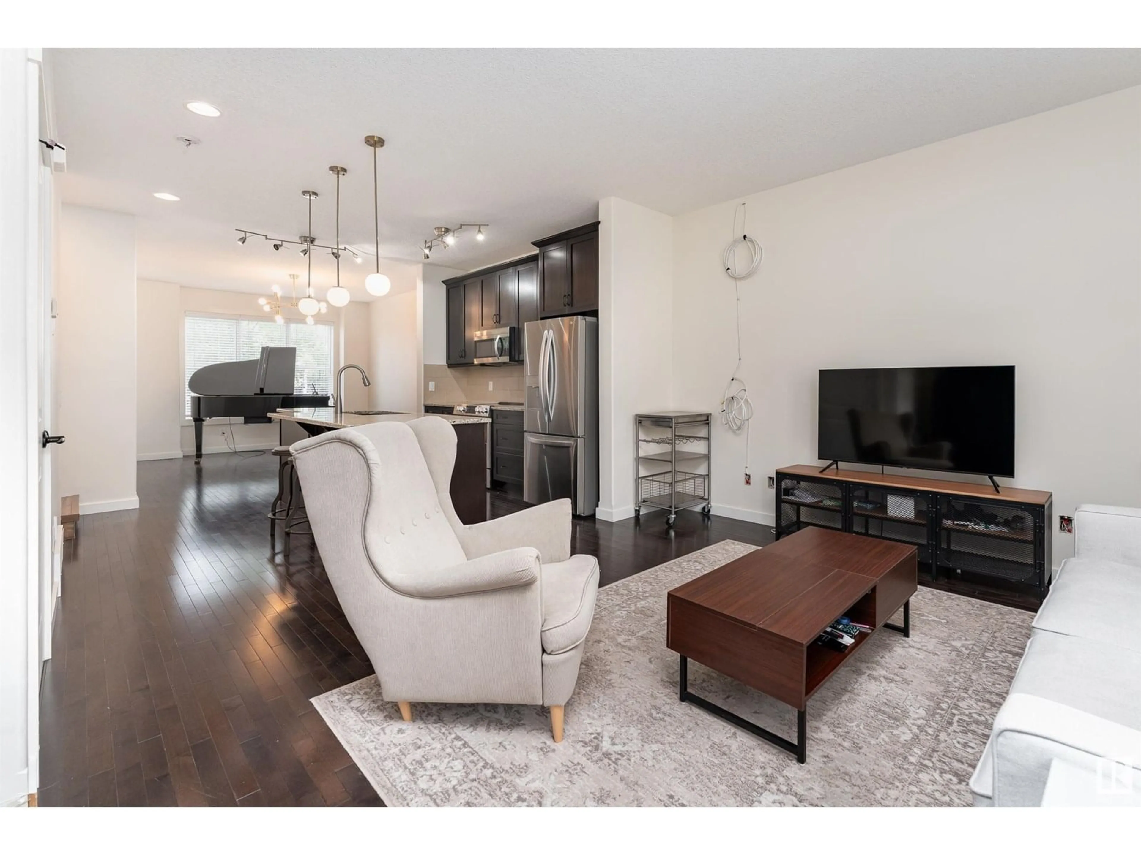 Living room with furniture, wood/laminate floor for 1060 GAULT BV, Edmonton Alberta T5E6N7