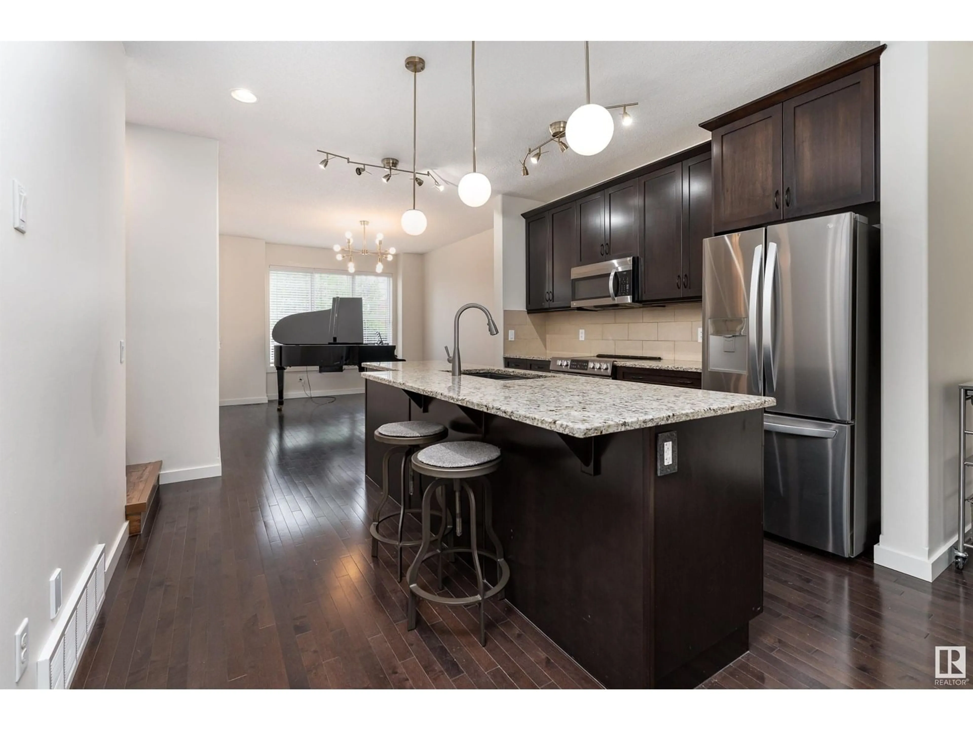 Open concept kitchen, wood/laminate floor for 1060 GAULT BV, Edmonton Alberta T5E6N7
