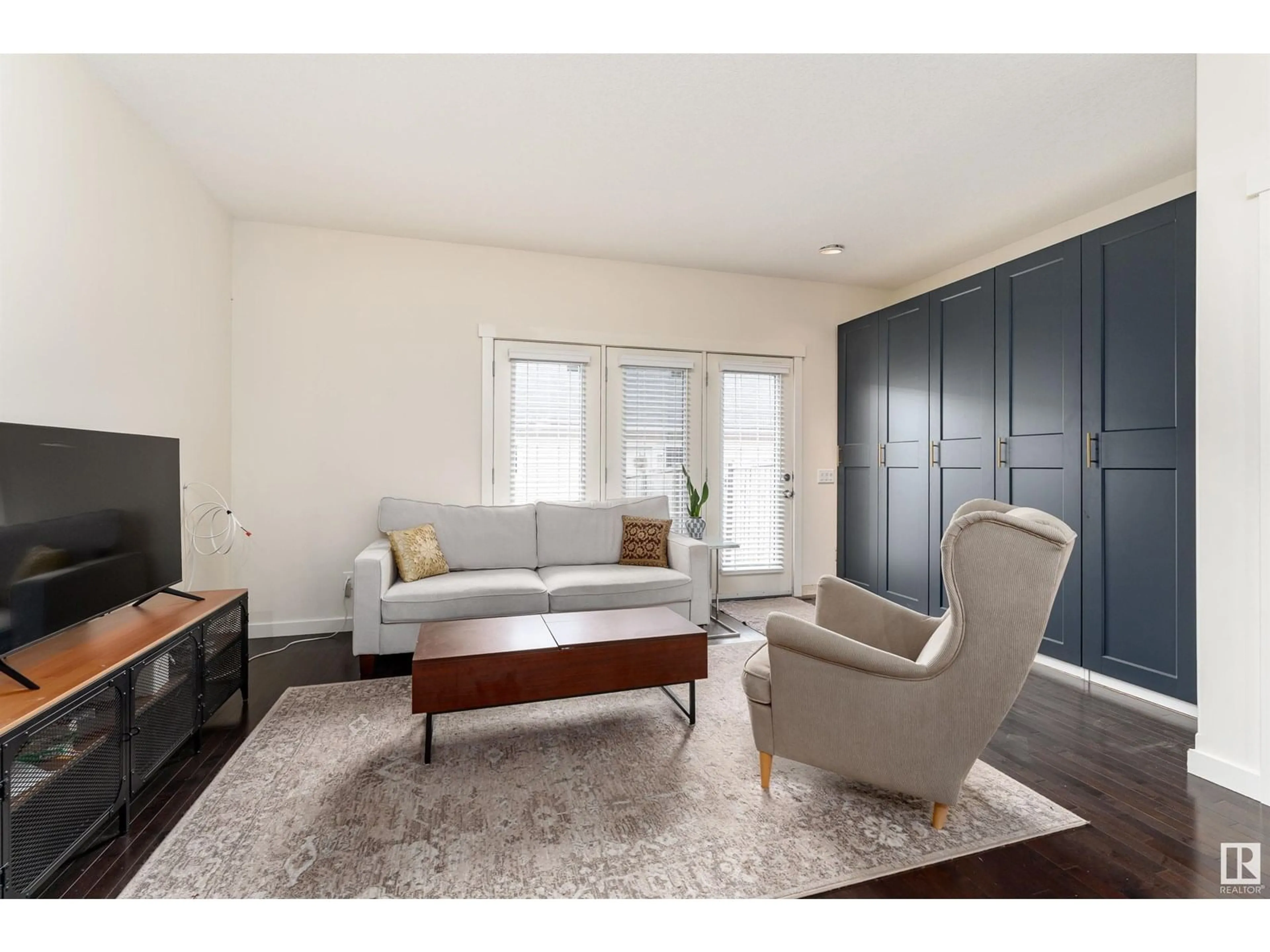 Living room with furniture, wood/laminate floor for 1060 GAULT BV, Edmonton Alberta T5E6N7